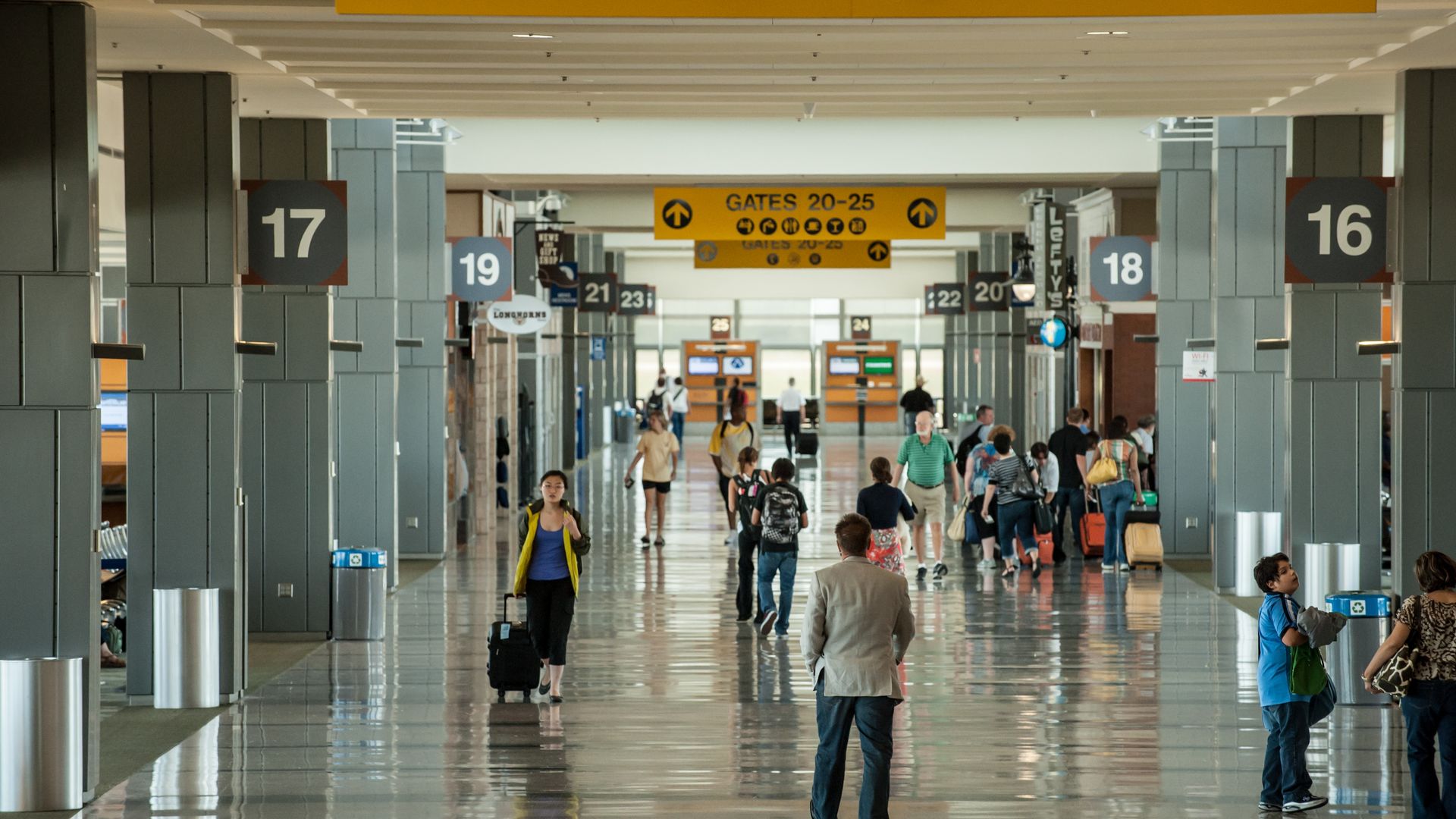Travelers in the terminal at Austin-Bergstrom International Airport.