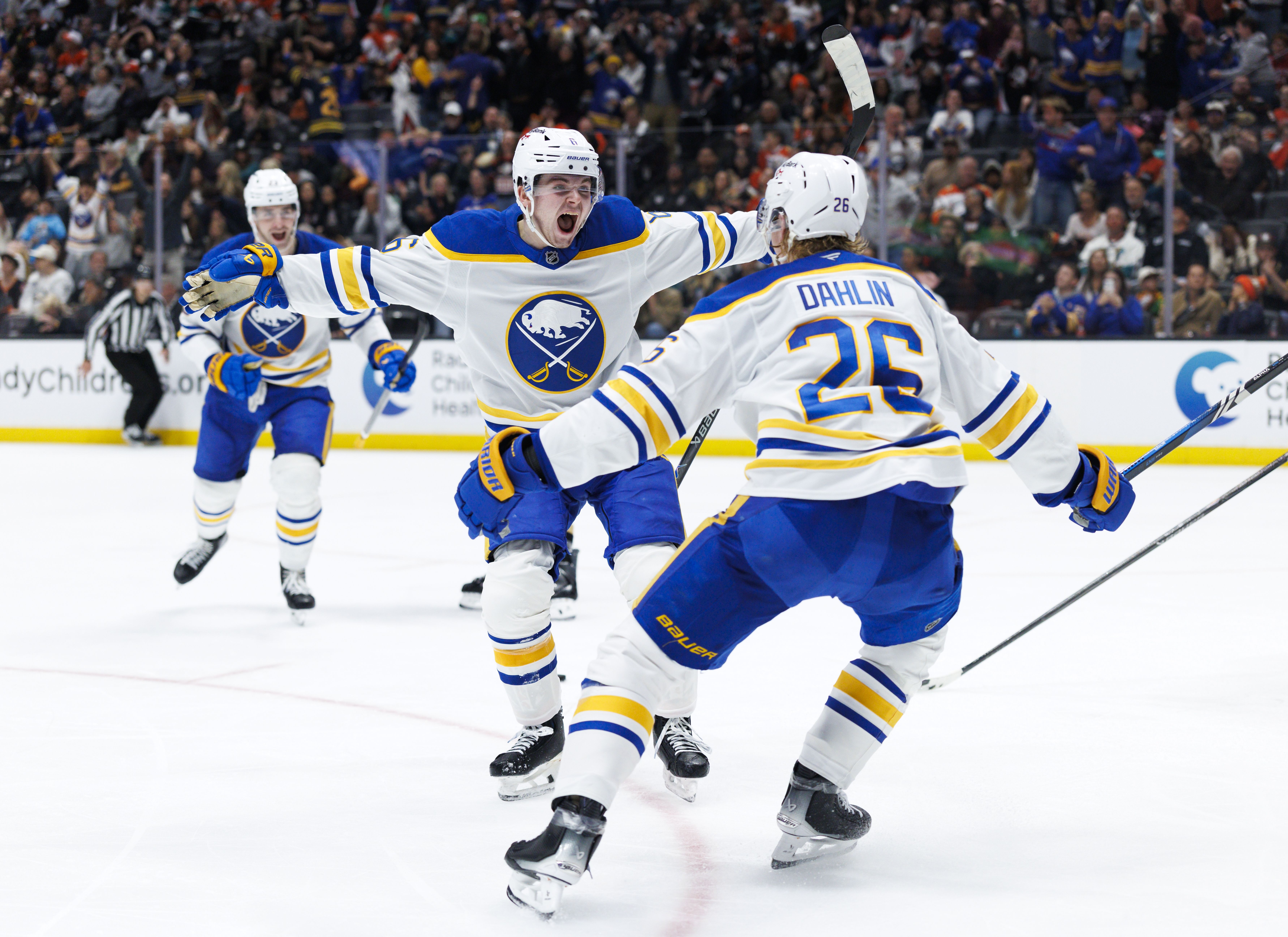 The Buffalo Sabres' Zach Benson and Rasmus Dahlin celebrate a goal in a March game against the Anaheim Ducks. Photo: Ric Tapia/Getty Images