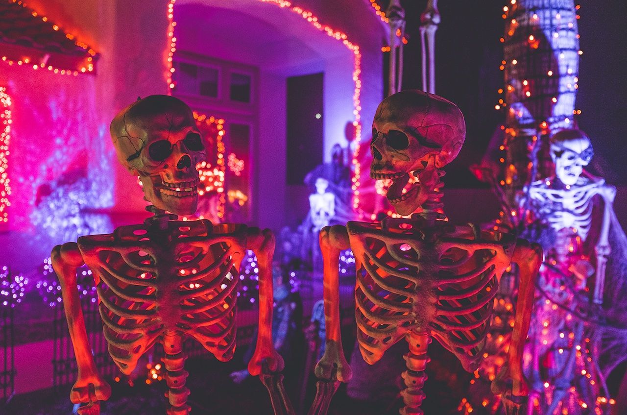 Skeletons in a red lit room