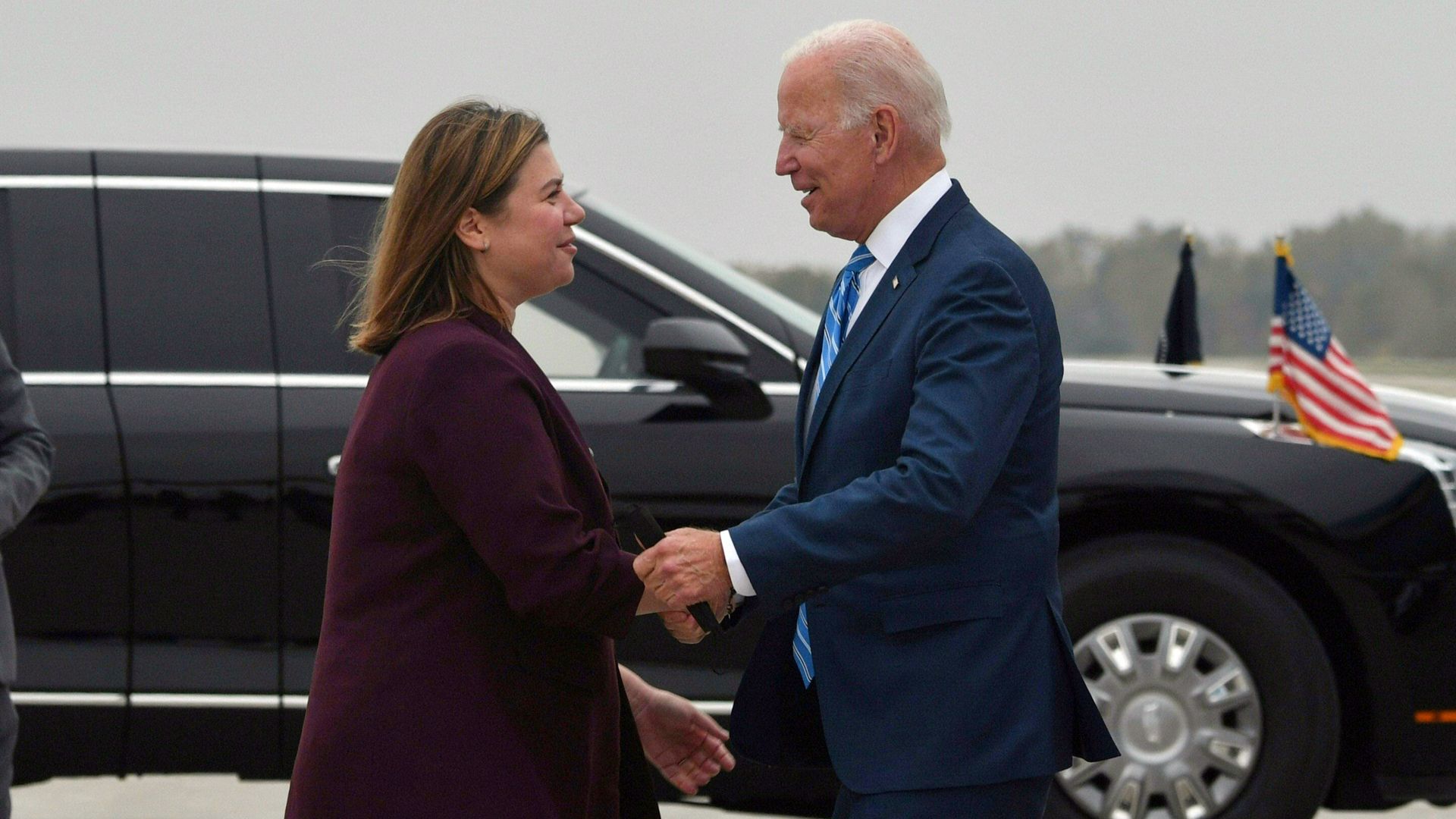 President Biden is seen greeting Rep. Elissa Slotkin after arriving in Michigan in October.