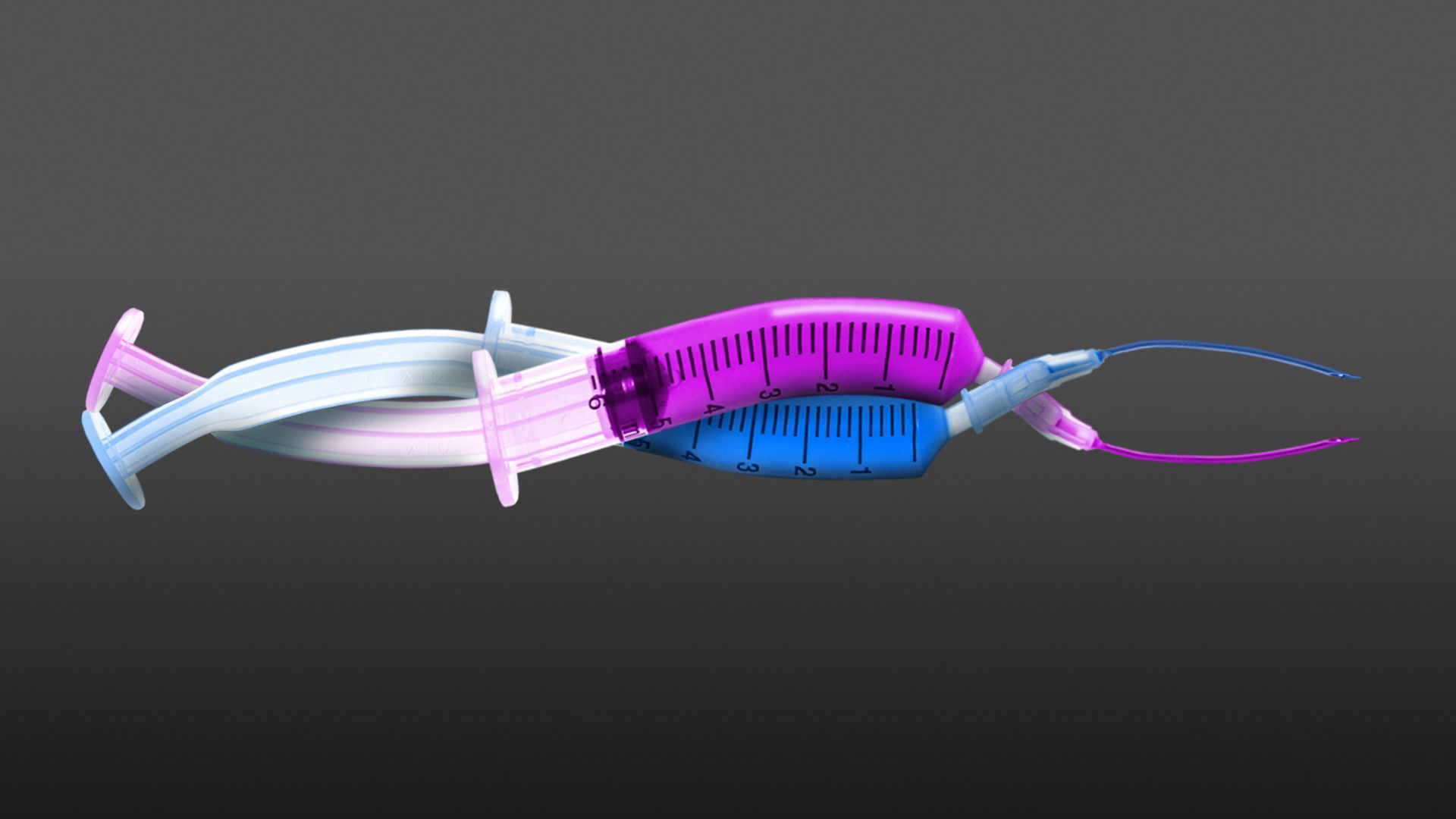 Illustration of two different syringes twisting together