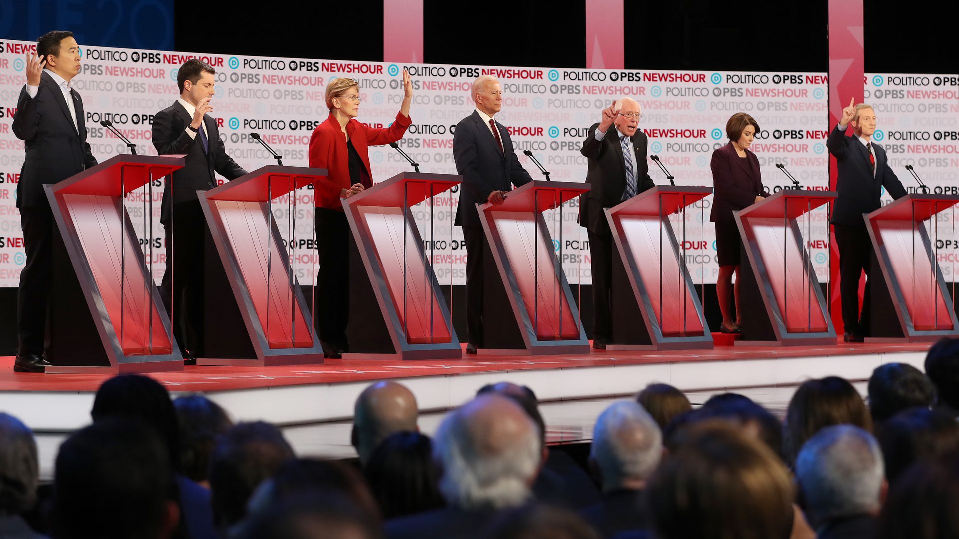 Candidates at their podiums during the debate.