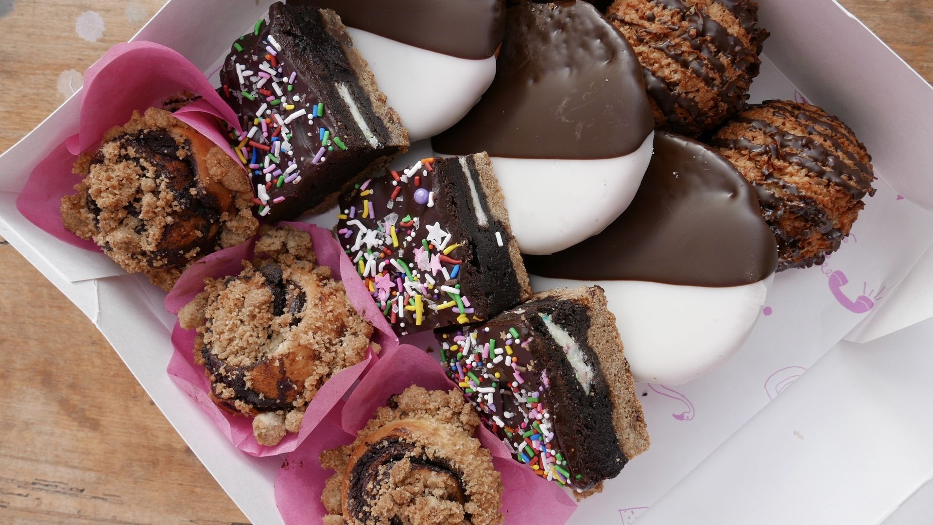 A box of assorted cookies and pastries.