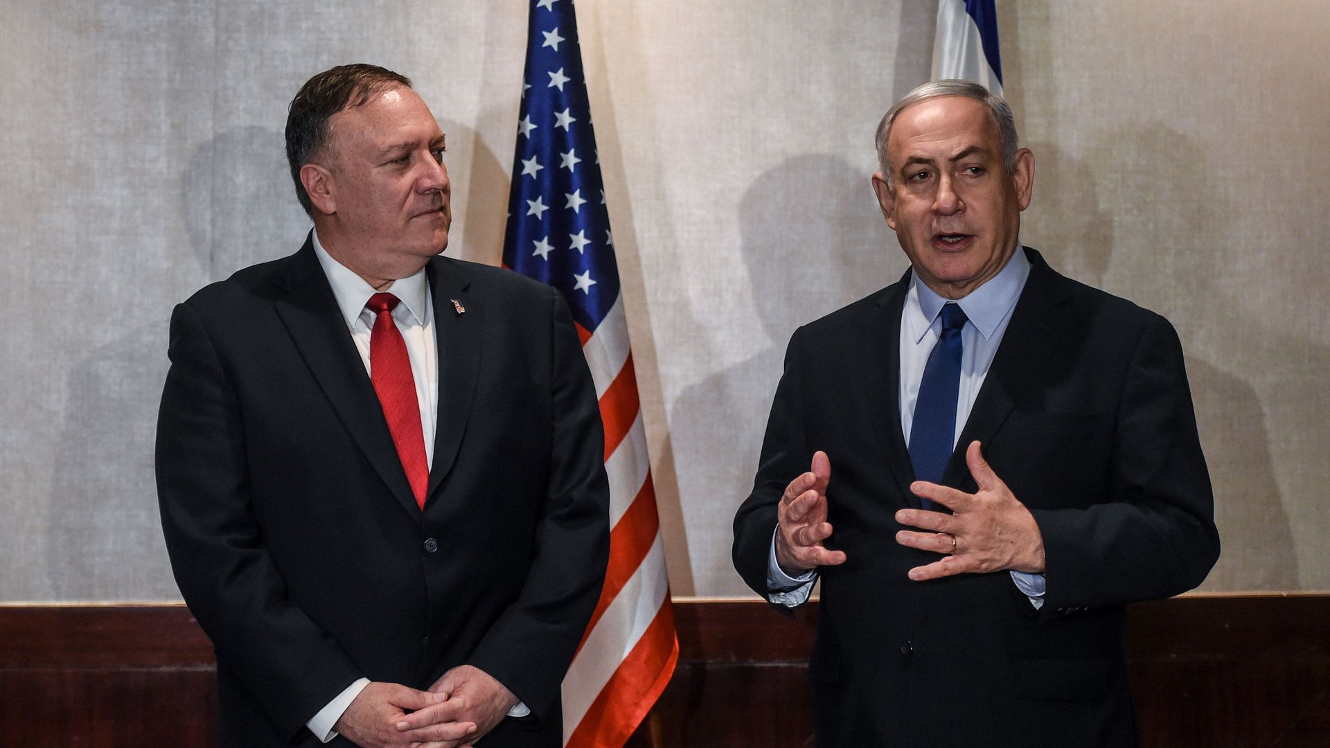 Mike Pompeo and Benjamin Netanyahu standing next to one another.