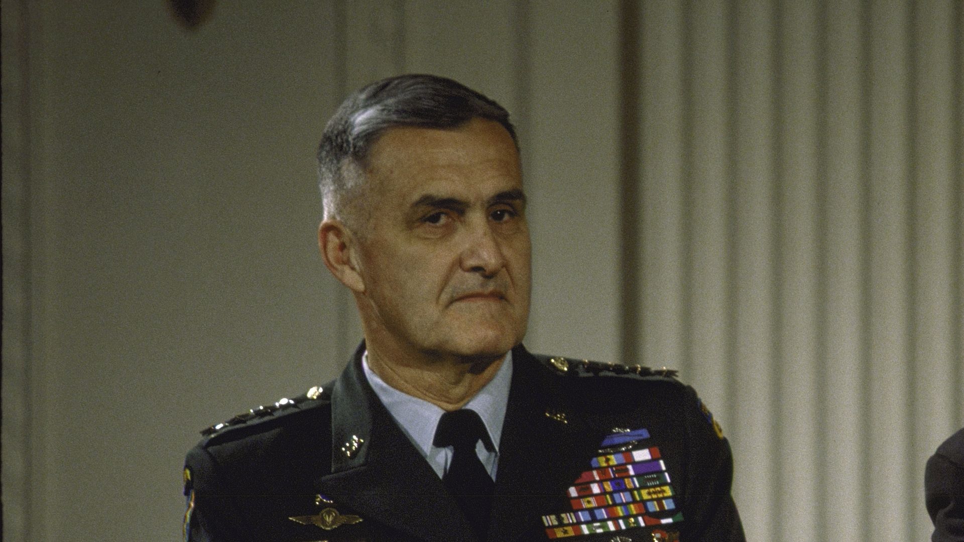 Hugh Shelton sits in uniform