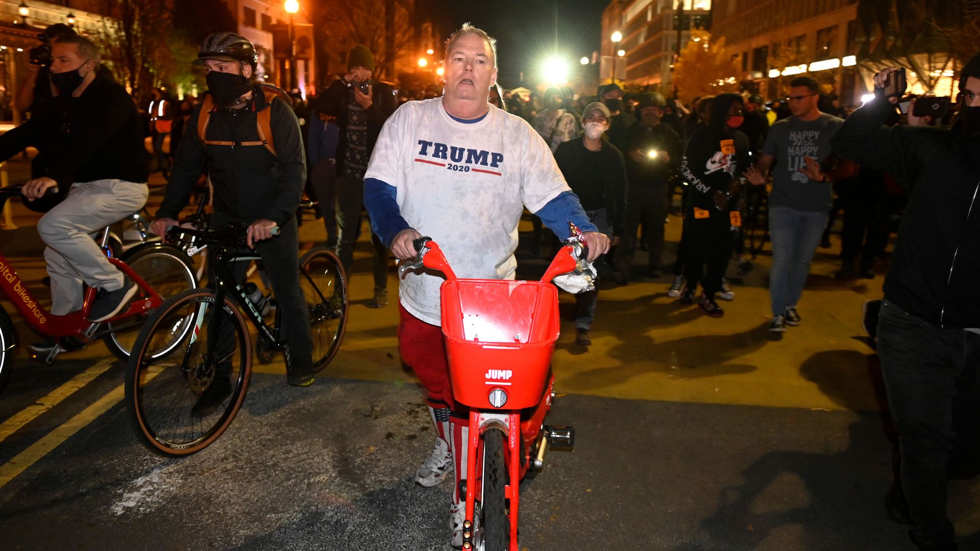 A supporter of US President Donald Trump walks out of Black Lives Matter Plaza after a scuffle with counter-protesters after pro-Trump supporters rallied in Washington, DC