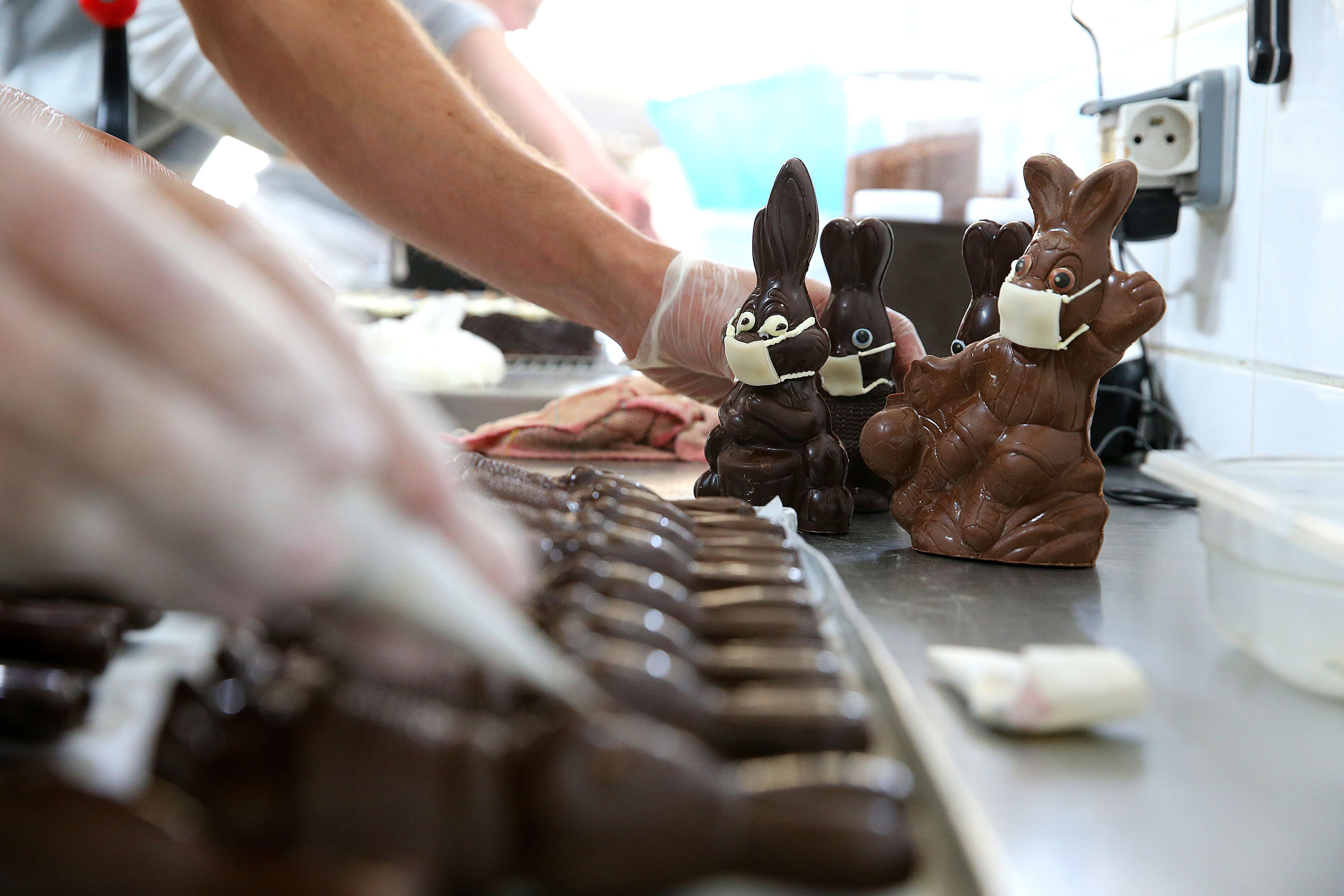 In this image, chocolate bunnies wear face masks