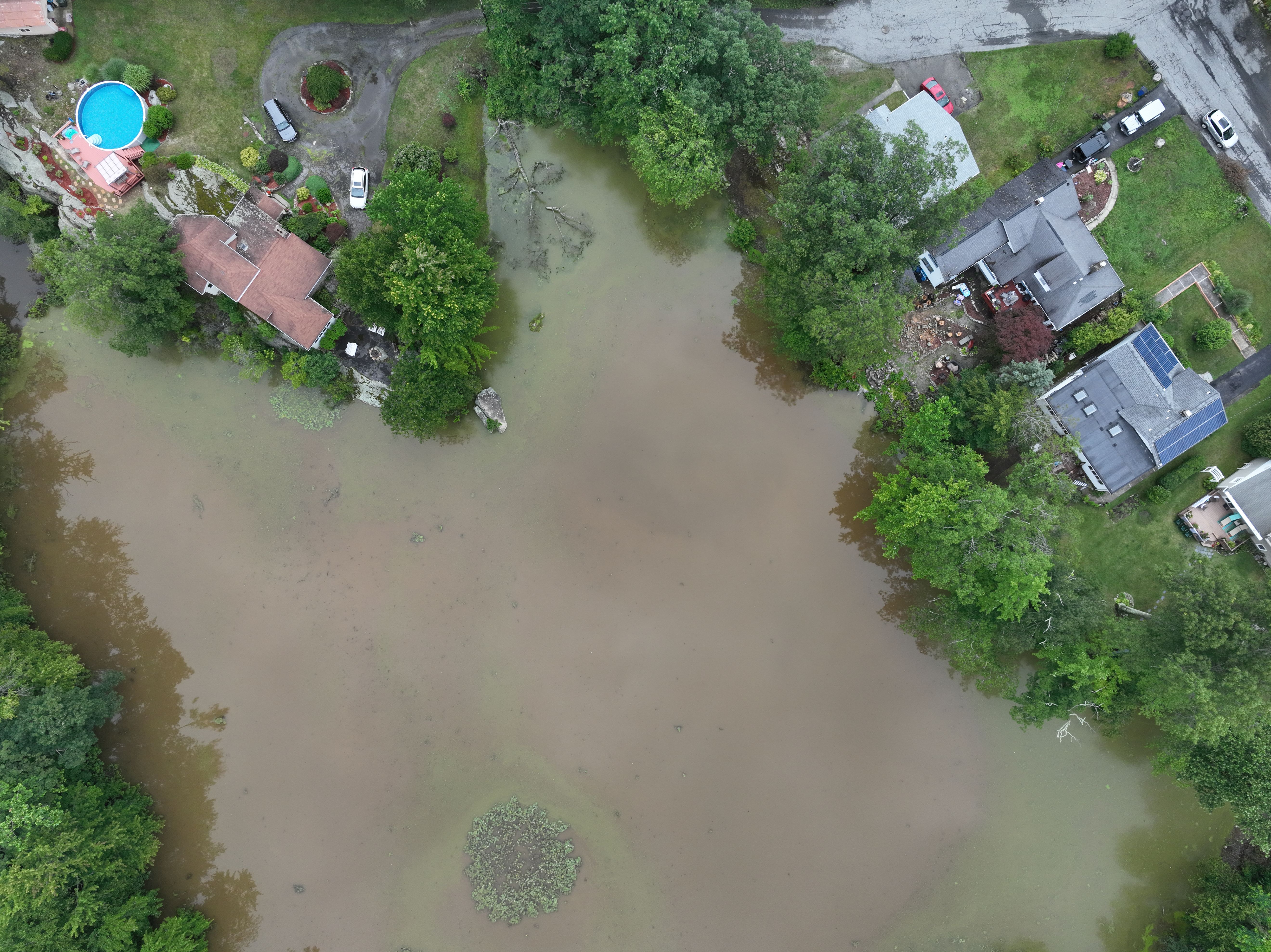 An aerial view shows flooding after historic rainfall north of New York City triggered dozens of water rescues and led to roadways being washed out after more than a half-foot of rain fell in only a few hours Sunday in Orange County, New York, United States on July 10.