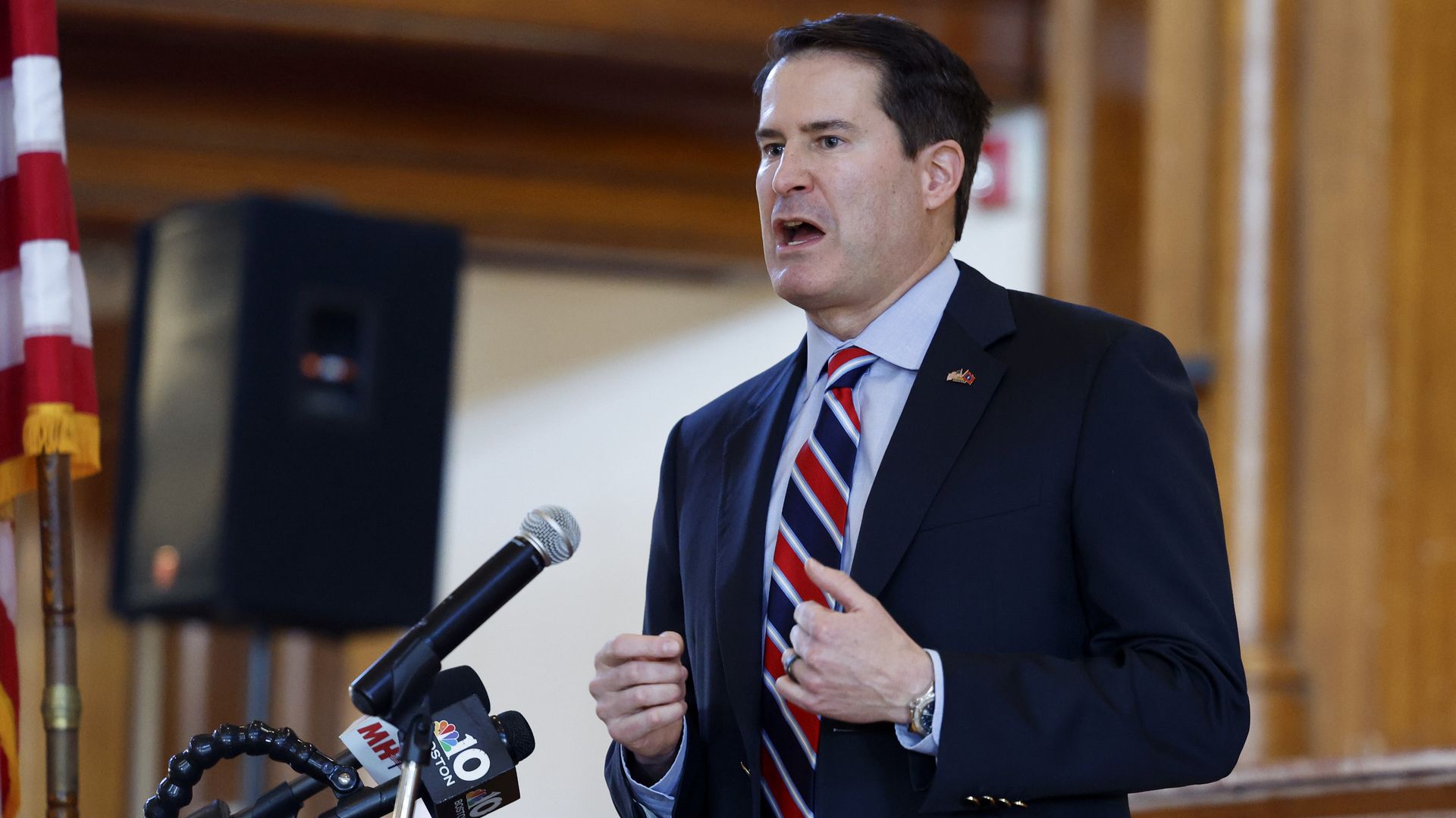 U.S. Rep. Seth Moulton speaks at a lectern in an auditorium in Marlbehead, Massachusetts.