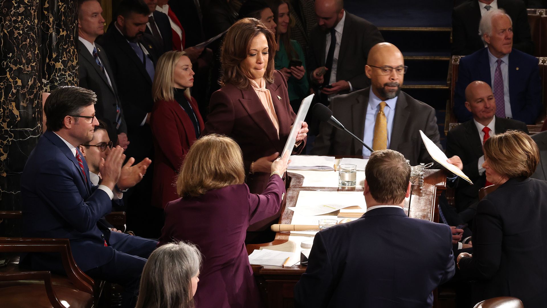 Vice President Harris and Speaker Johnson oversee a joint session of Congress surrounded by other lawmakers.