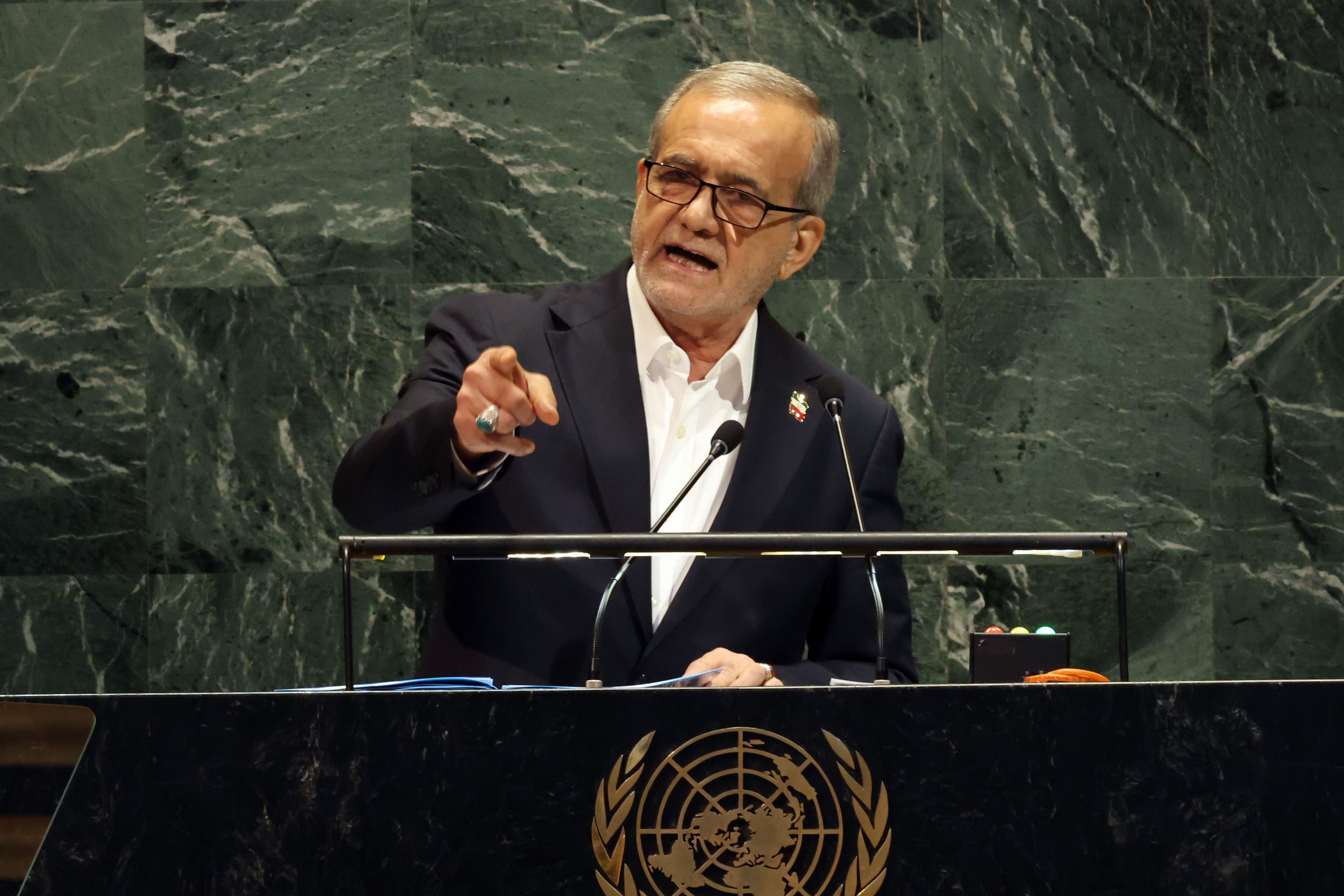 Iran President Masoud Pezeshkian speaks at a podium during the UN General Assembly in New York.