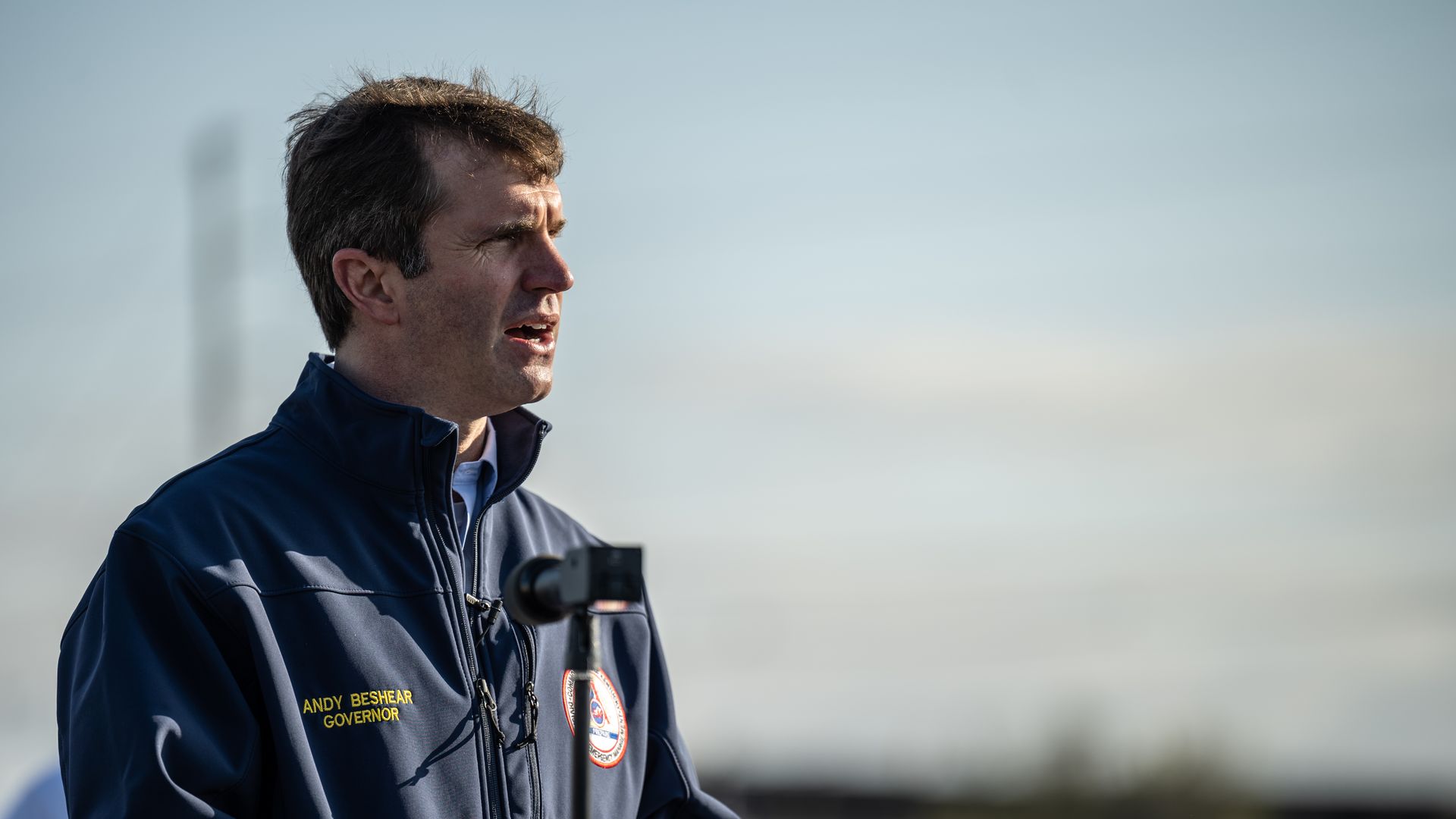 Photo of Andy Beshear speaking outdoors
