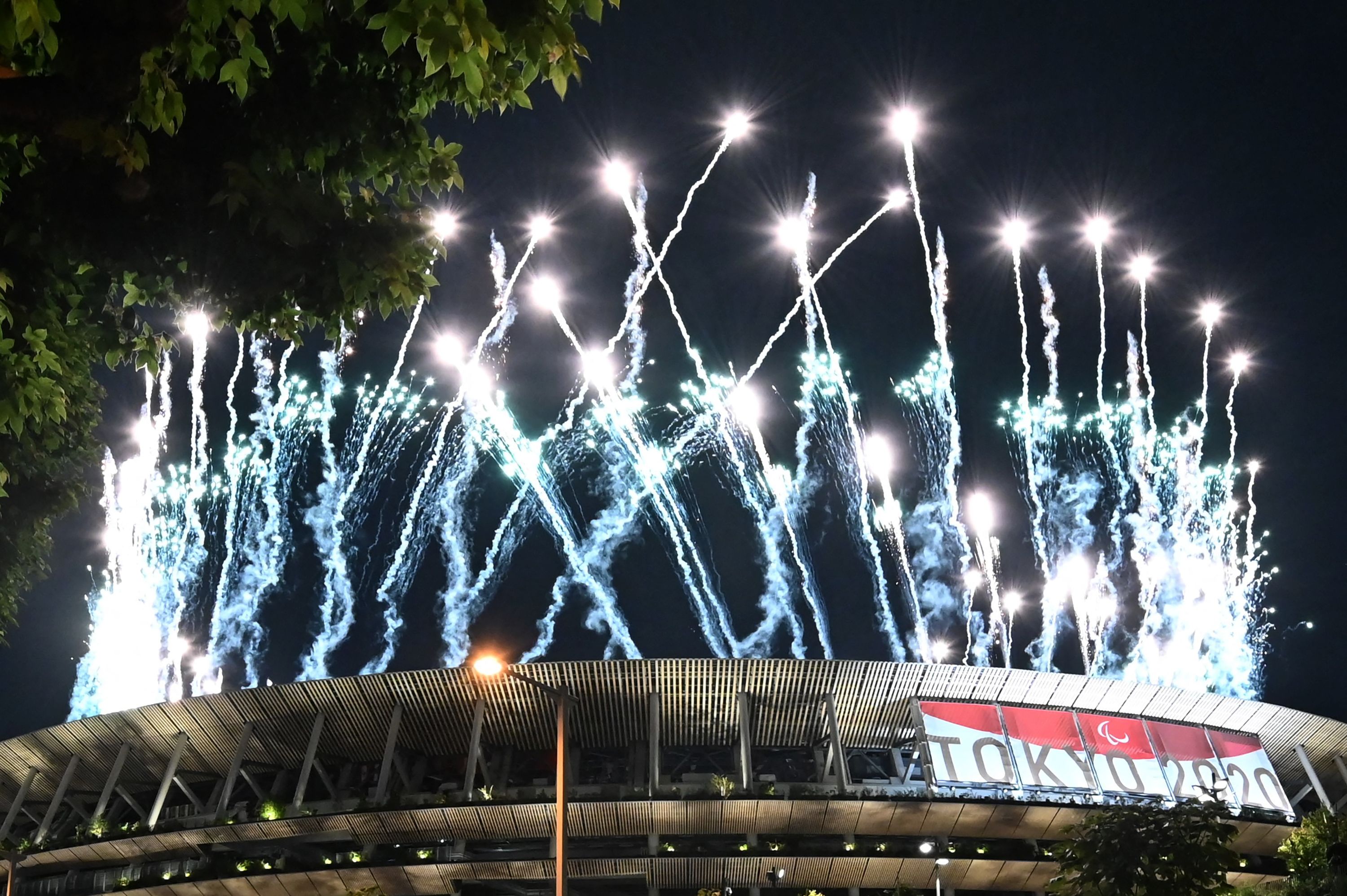 Fireworks light up the sky above the Olympic Stadium during the opening ceremony for the Tokyo 2020 Paralympic Games in Tokyo on August 24, 2021.