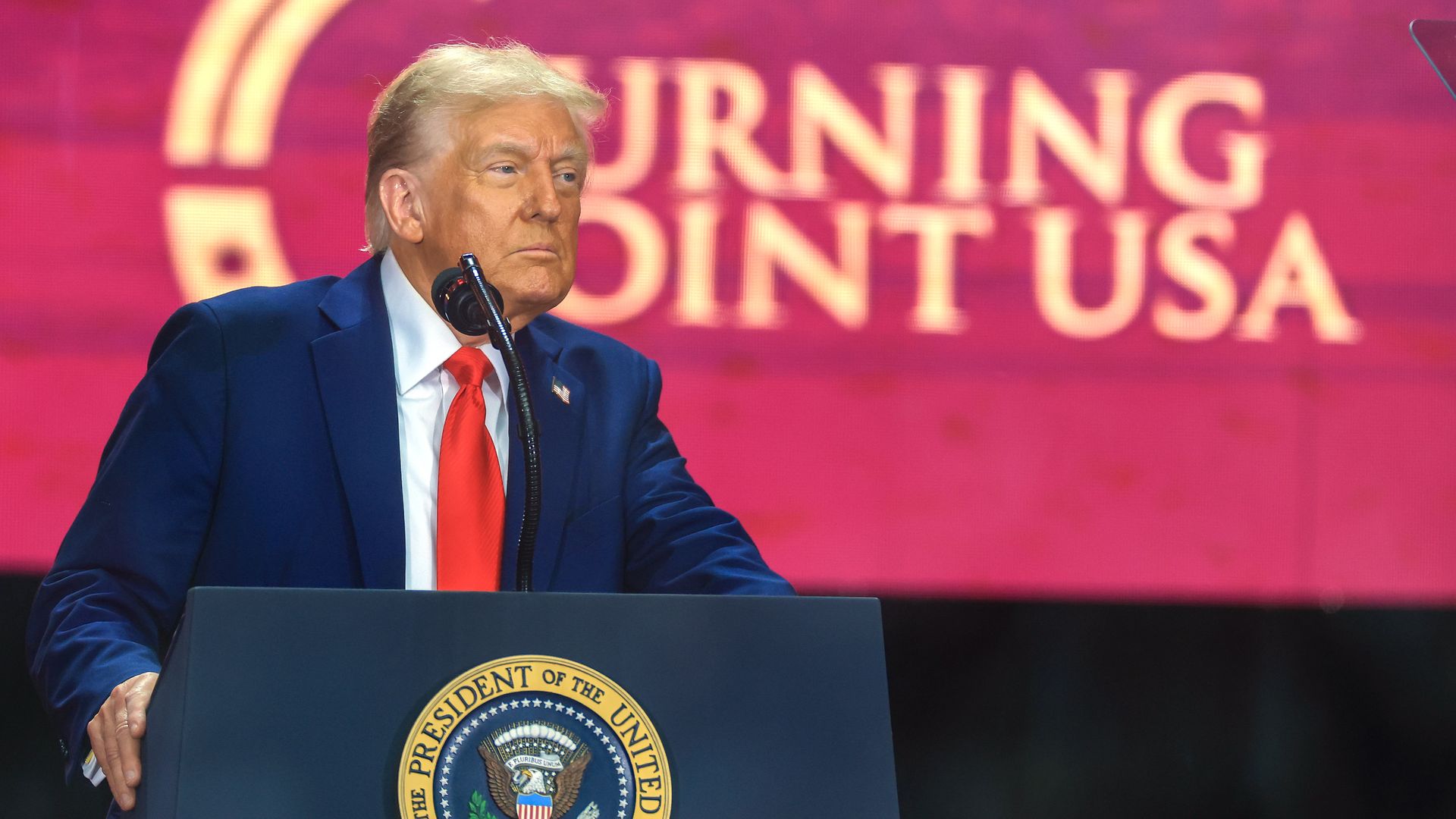 President Trump addresses mourners at a memorial service for Charlie Kirk at State Farm Stadium in Glendale, Arizona.