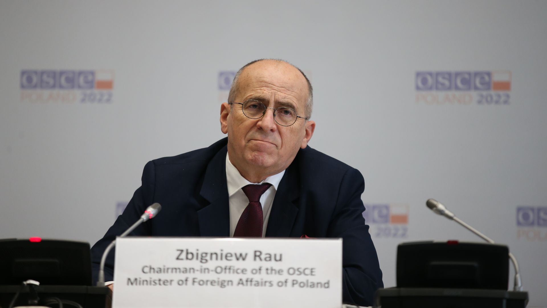 Polish Foreign Minister and Incoming Chairperson in Office Zbigniew Rau is seen addressing reporters at a media conference.