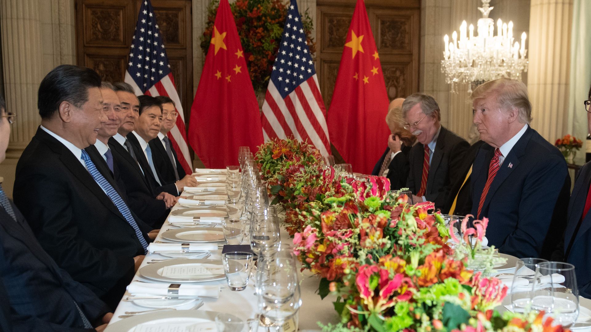 US President Donald Trump (R) and China's President Xi Jinping (L) along with members of their delegations, hold a dinner meeting at the end of the G20 summit.