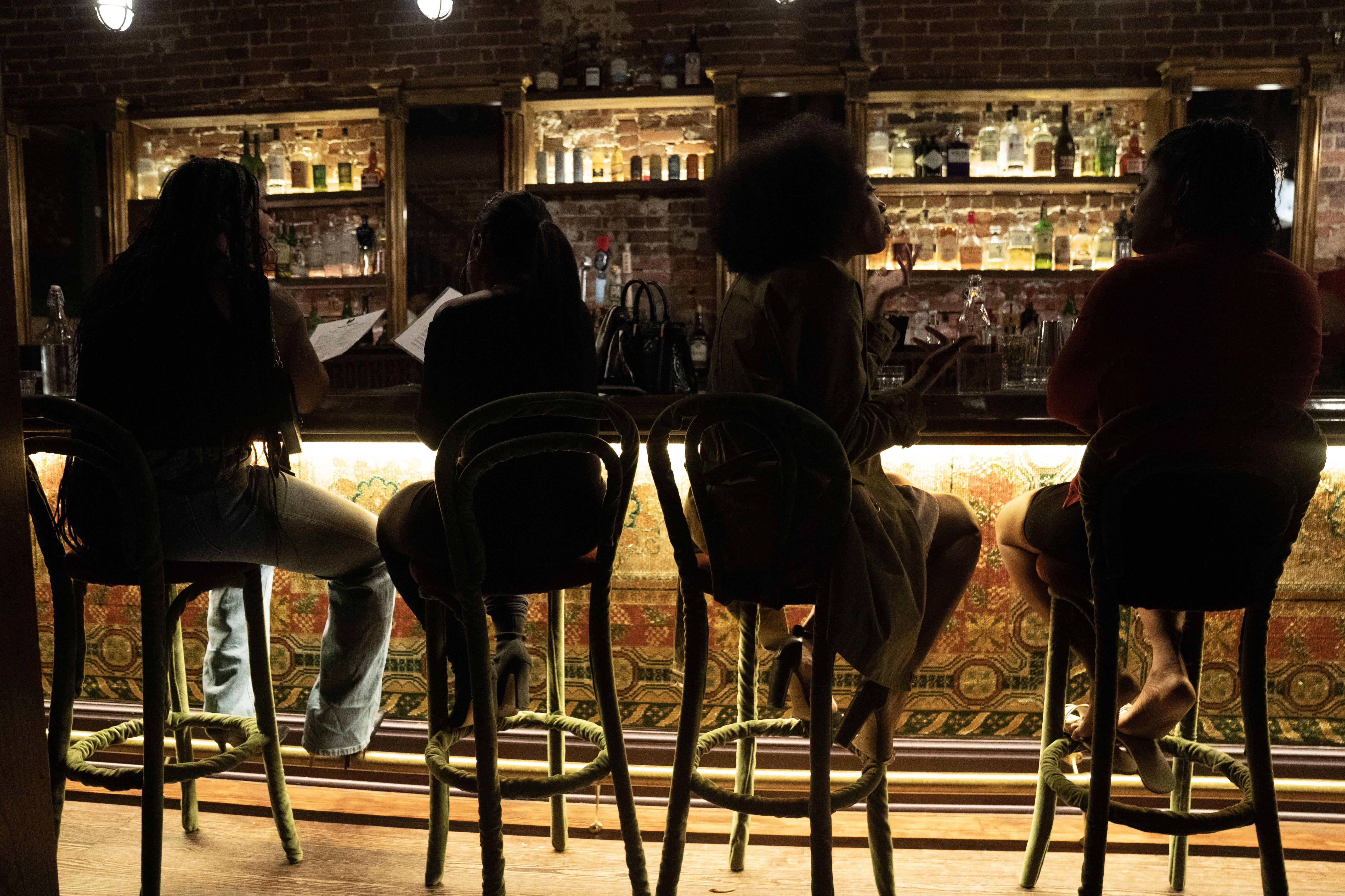 Patrons talking at Hush Harbor bar in Washington, D.C.