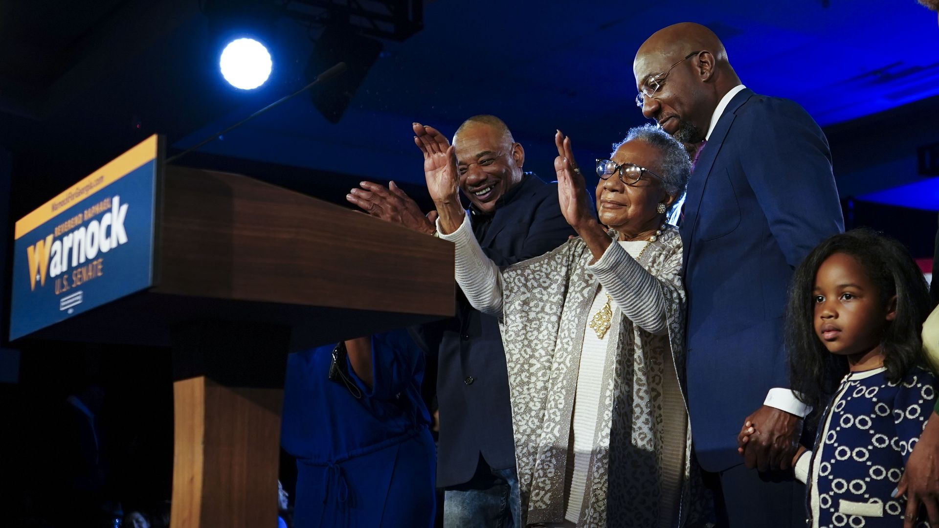 Raphael Warnock with his mother and daughter
