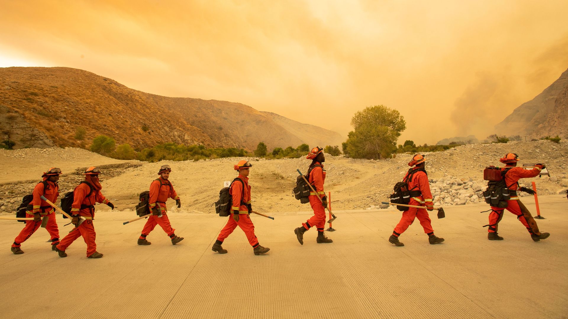 Inmate firefighters arrive at the scene of the Water fire in Whitewater, California 