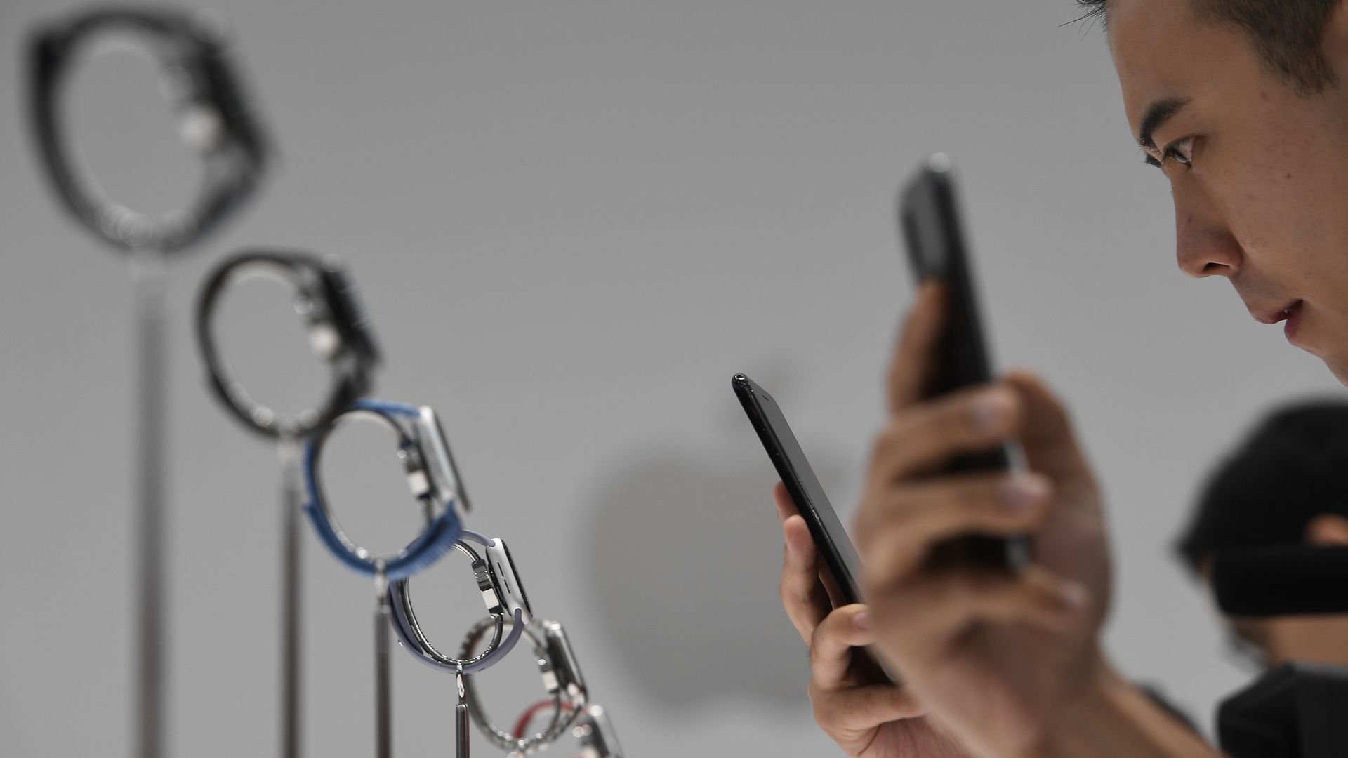 People use smartphones to take photos of Apple Watches