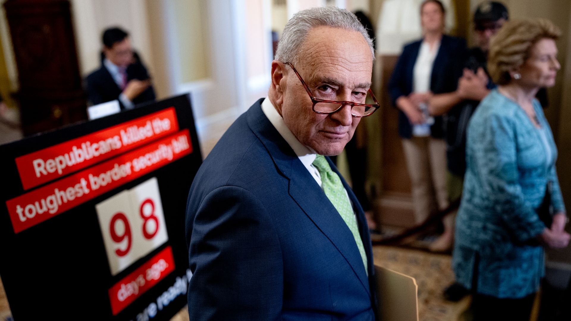 Senate Majority Leader Chuck Schumer (D-NY) listens to a reporter's question during a presser