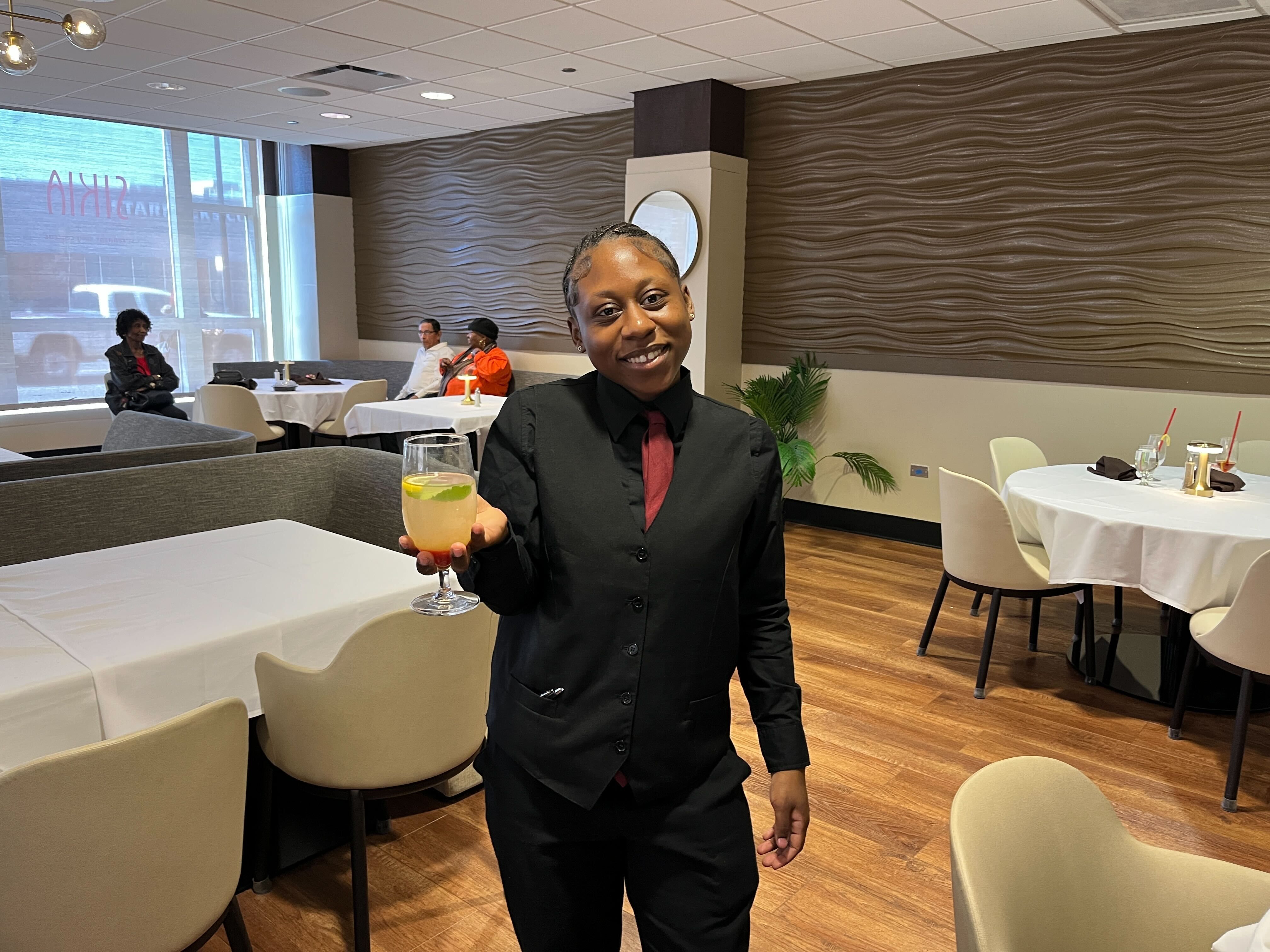 woman carrying a lemonade