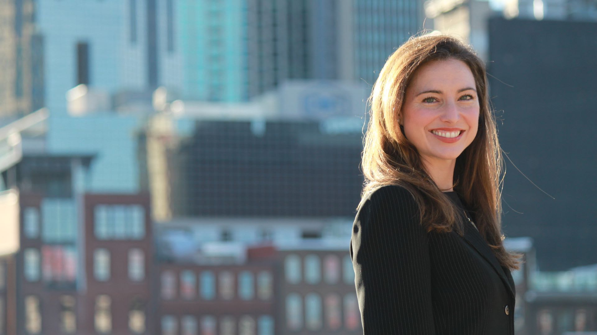 Headshot of Sara Beth Myers in front of the Nashville skyline.