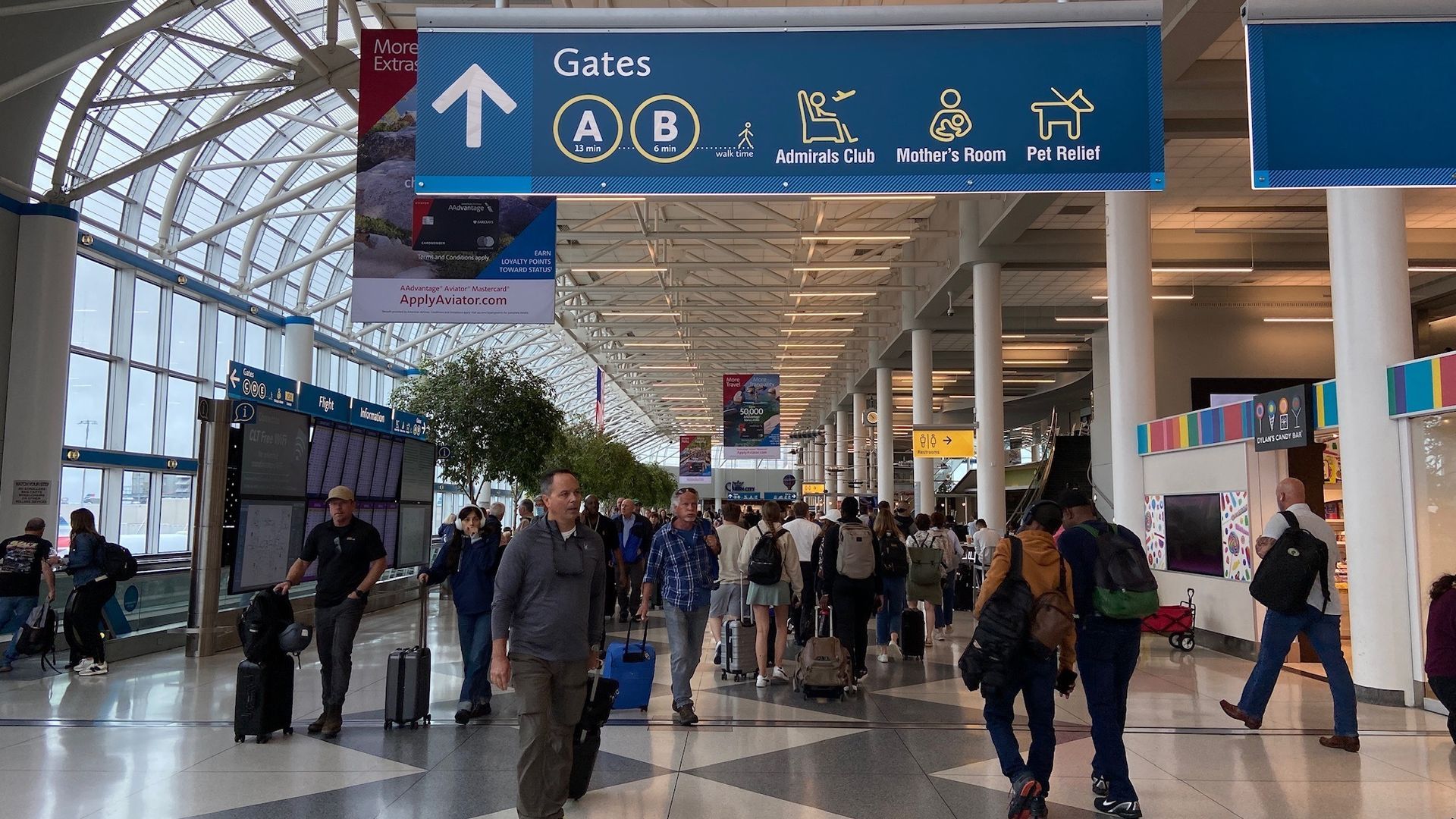 Passengers walk through Charlotte's airport.
