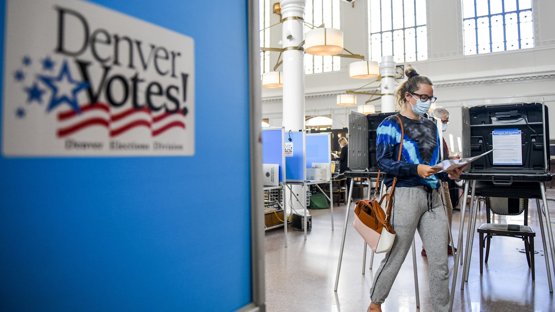 Kendall Althans votes in the June primary election at a polling center in Denver.