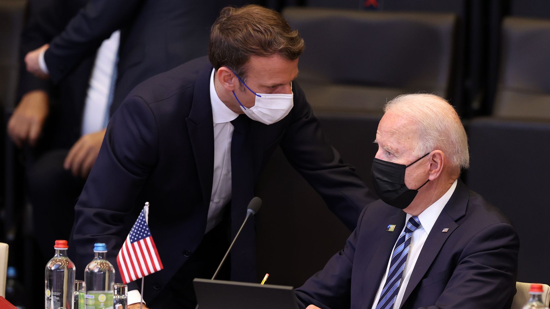 President Joe Biden (R) and French President Emmanuel Macron (L) have a conversation ahead of the NATO summit  in Brussels, on June 14, 2021.