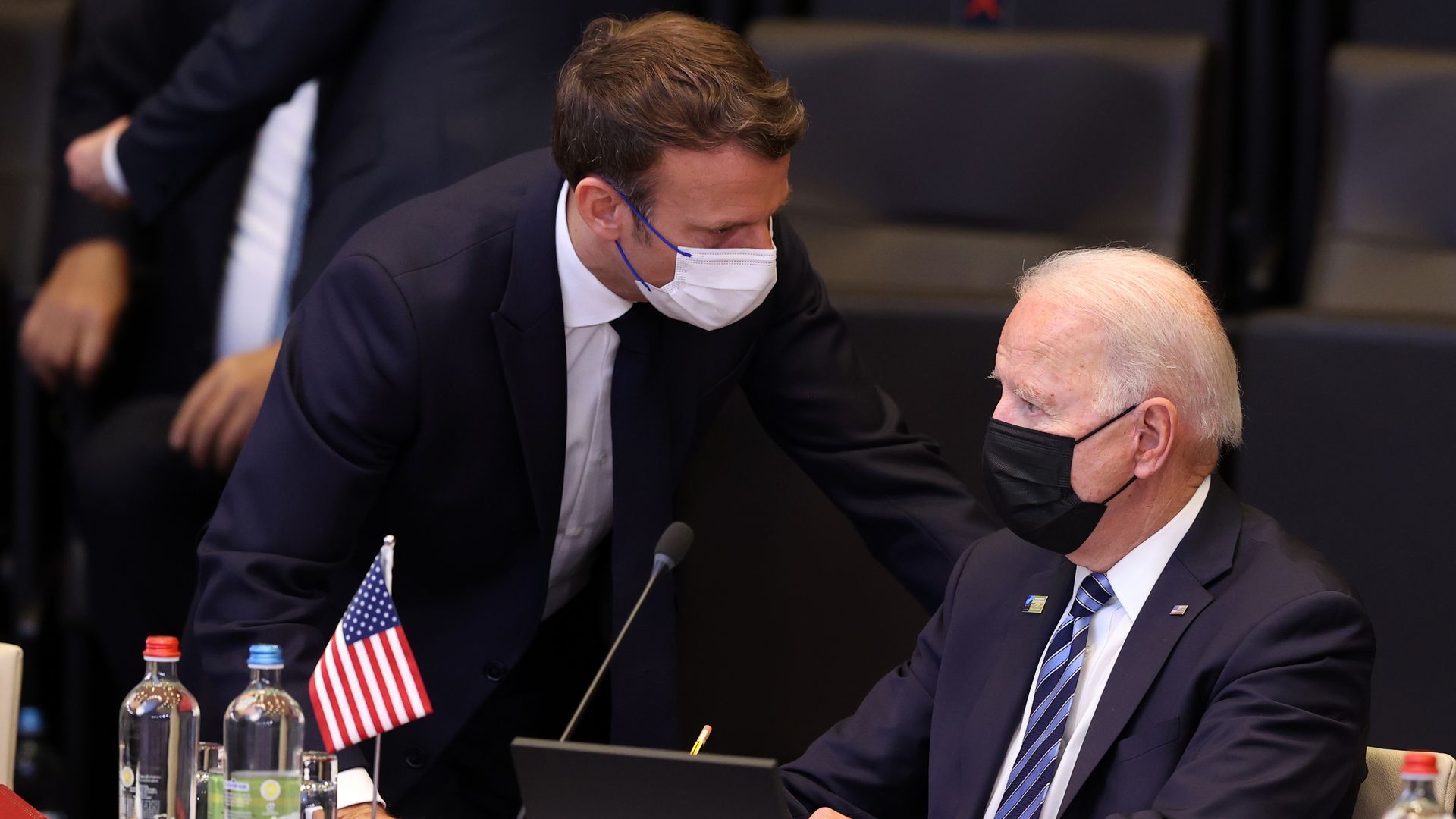 President Joe Biden (R) and French President Emmanuel Macron (L) have a conversation ahead of the NATO summit in Brussels, on June 14, 2021.