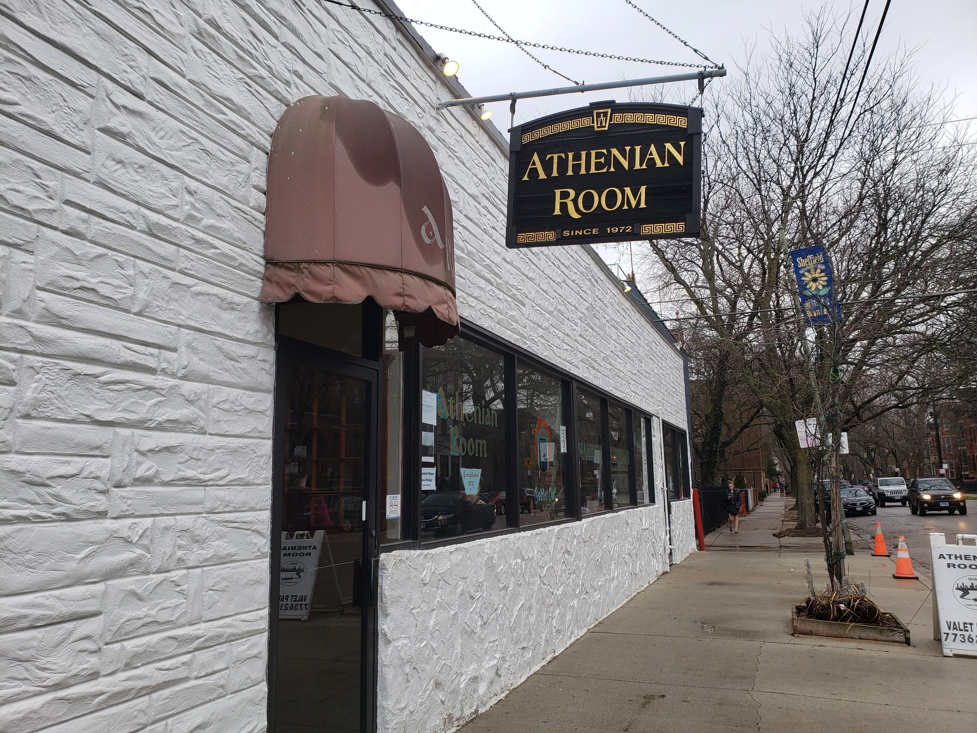 A restaurant with a sign saying "Athenian Room" 