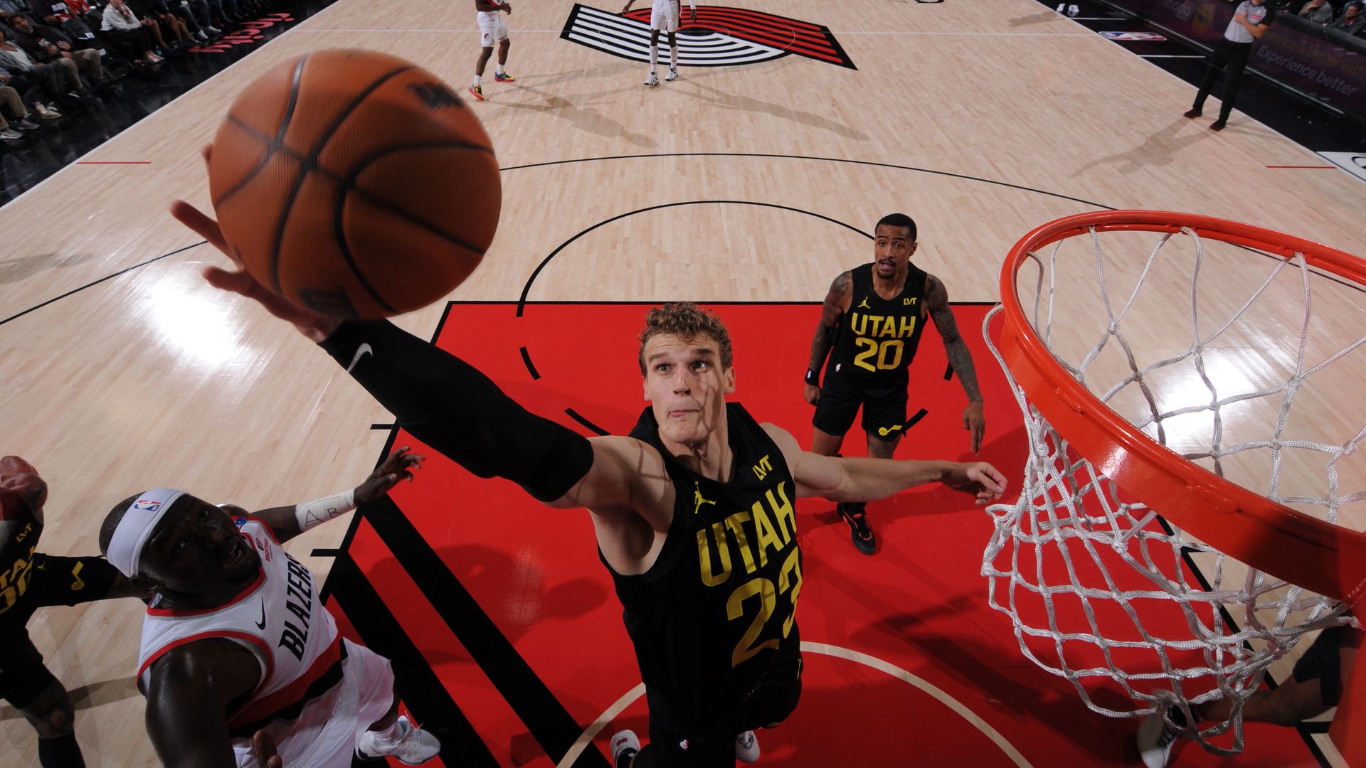 PORTLAND, OR - OCTOBER 18: Lauri Markkanen #23 of the Utah Jazz grabs the rebound during the game against the Portland Trail Blazers on October 18, 2024 at the Moda Center Arena in Portland, Oregon.