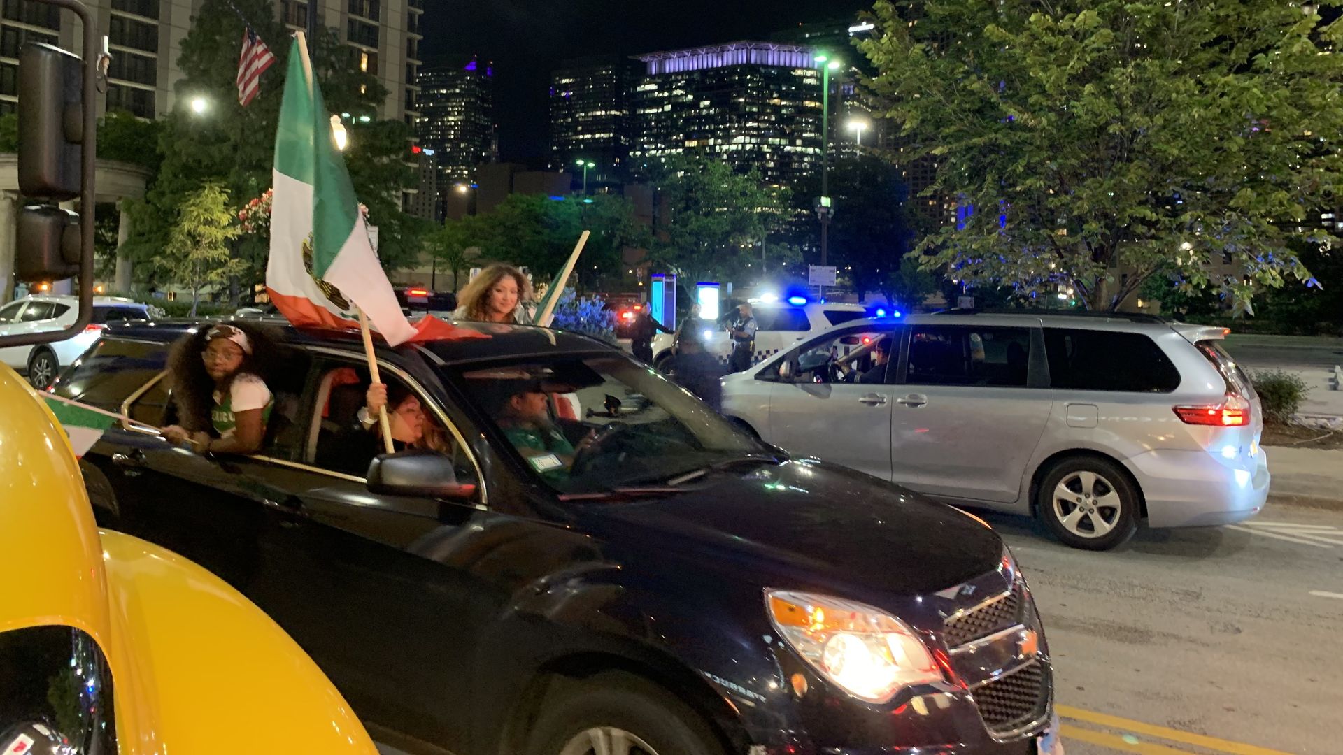 Photo of a car decked out in Mexican flags stuck in traffic jam 