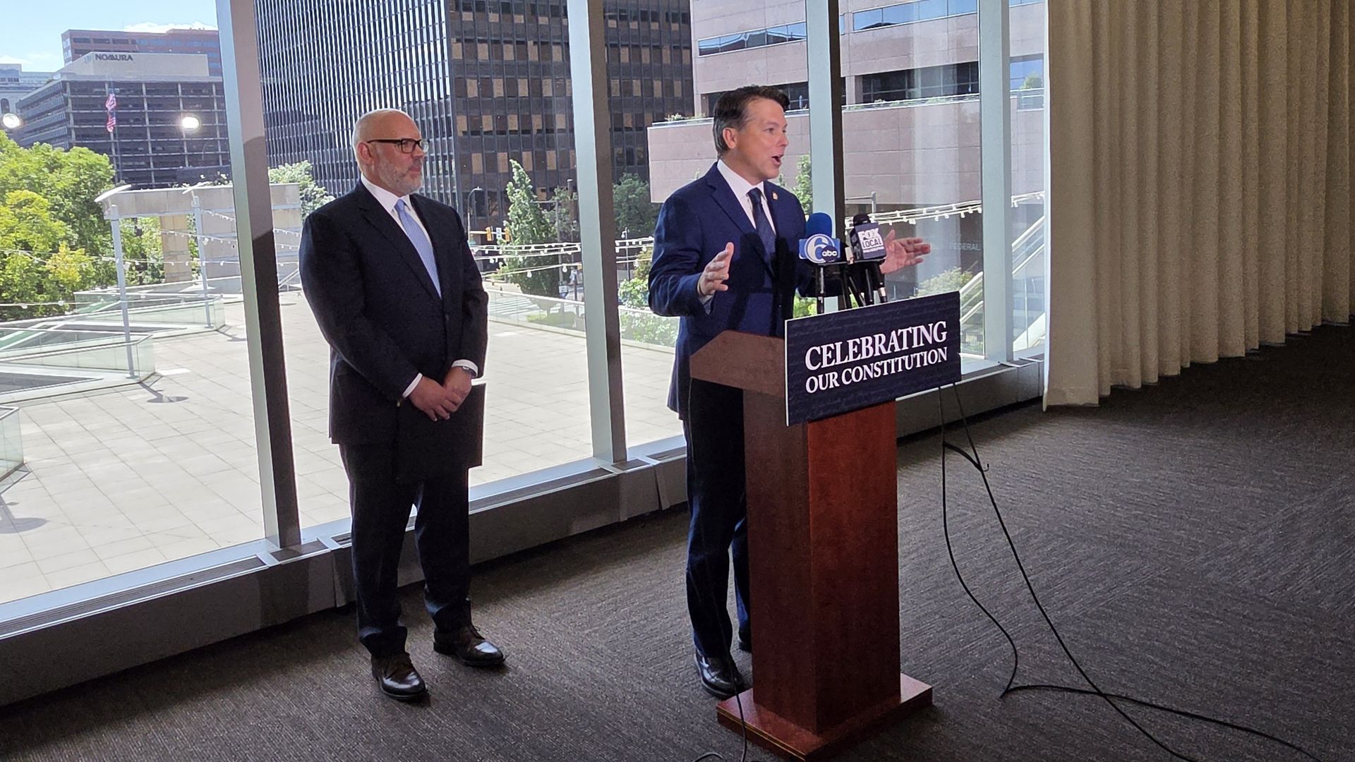 U.S. Rep Brendan Boyle standing with Constitution Center CEO Vince Stango while announcing a bill to create a commission for the 250th anniversary of the Constitution.