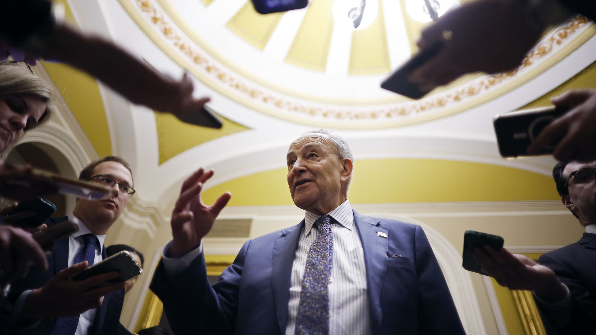 Senate Majority Leader Charles Schumer (D-NY) talks reporters as he returns to the U.S. Capitol following meetings at the White House on February 27, 2024 in Washington, DC. 