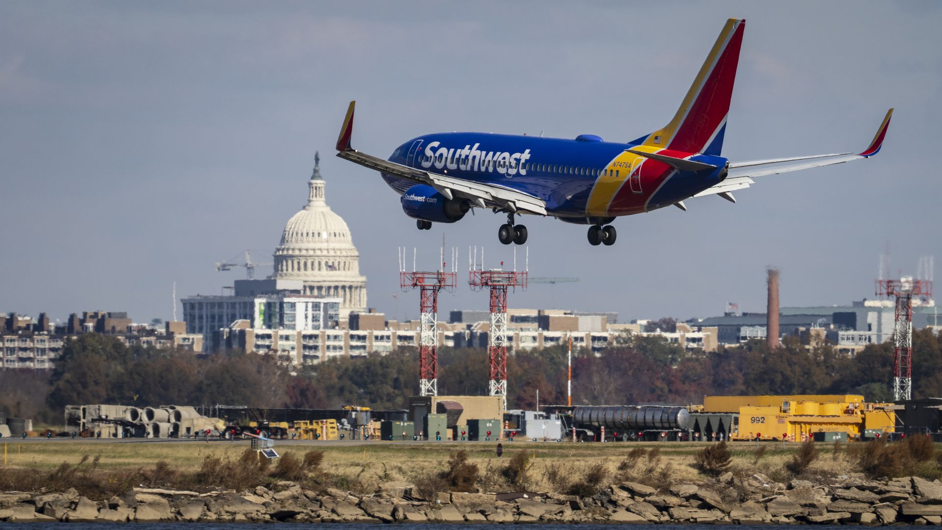 A Southwest plane takes off with the U.S. Capitol in the background. 