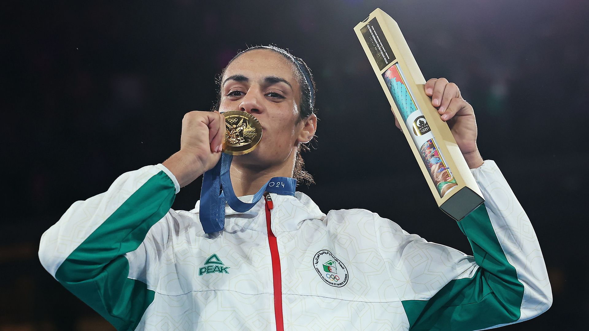 Algerian boxer Imane Khelif celebrates her gold medal win.