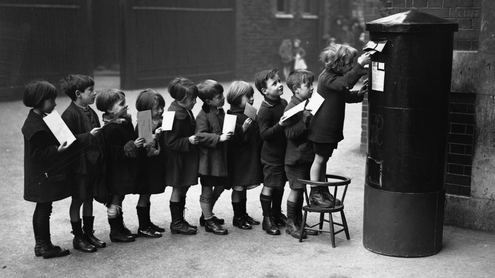 Boys lined up to mail a letter