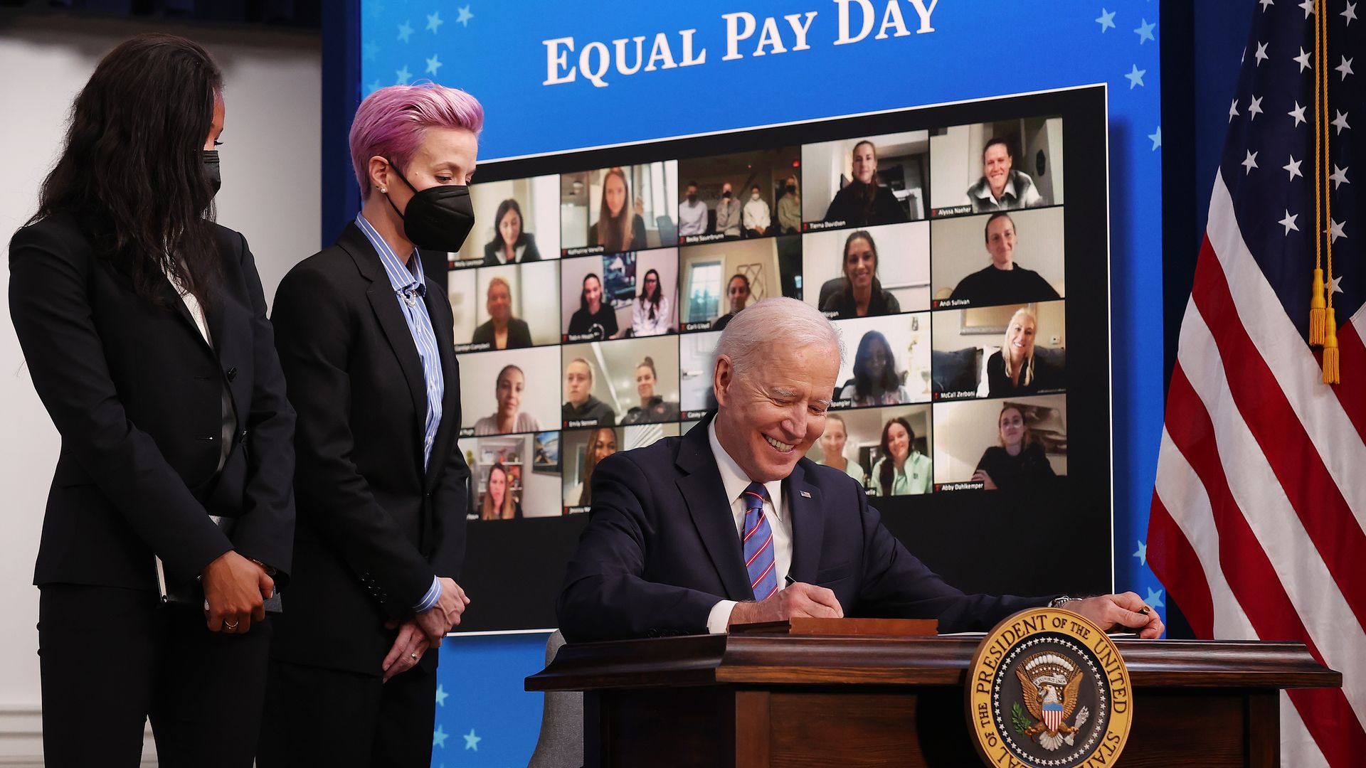 Soccer players Margaret Purce and Megan Rapinoe with President Biden in the Eisenhower Executive Office Building on March 24.