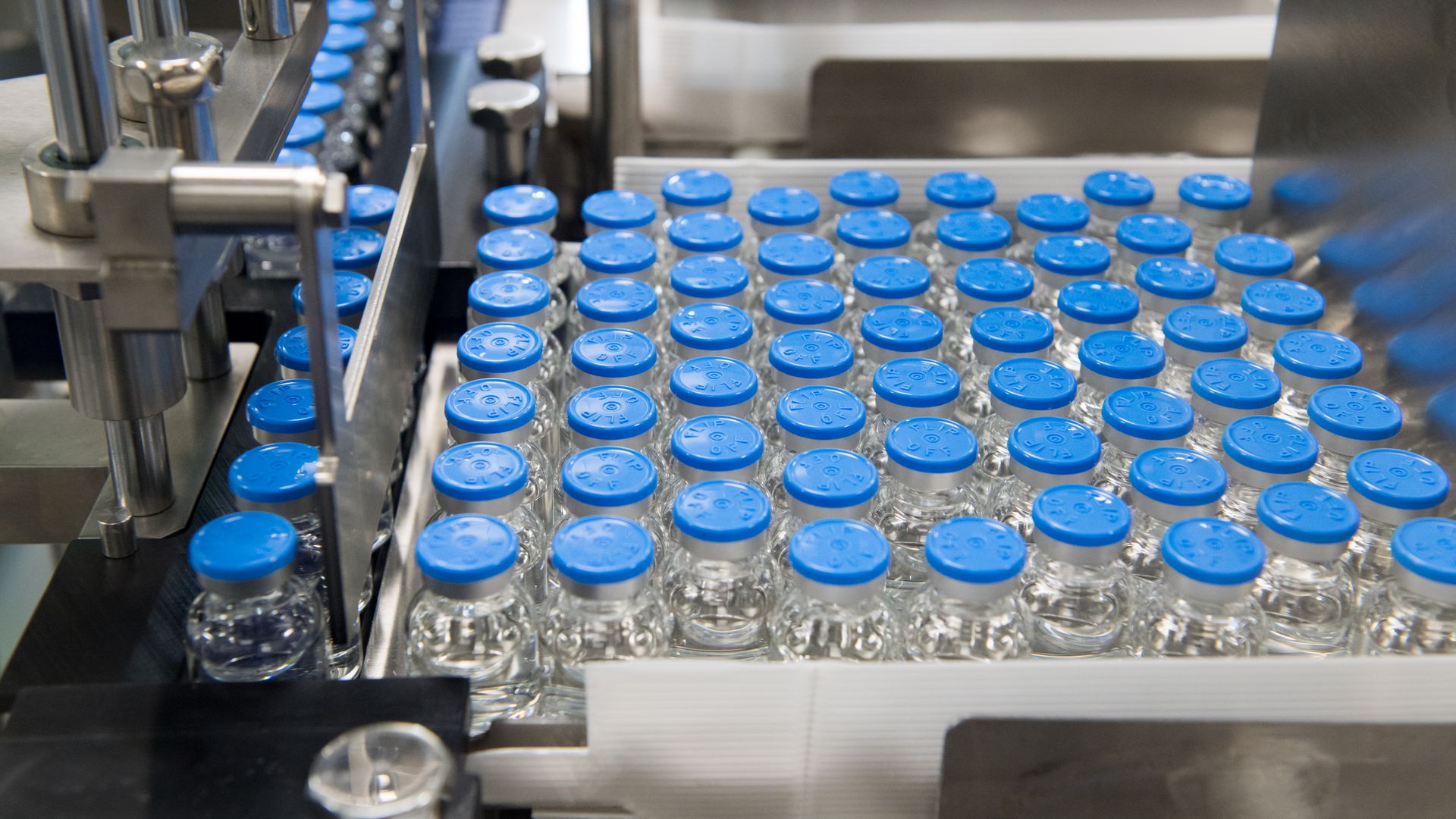 Small bottles filled with a sterile cancer drug.