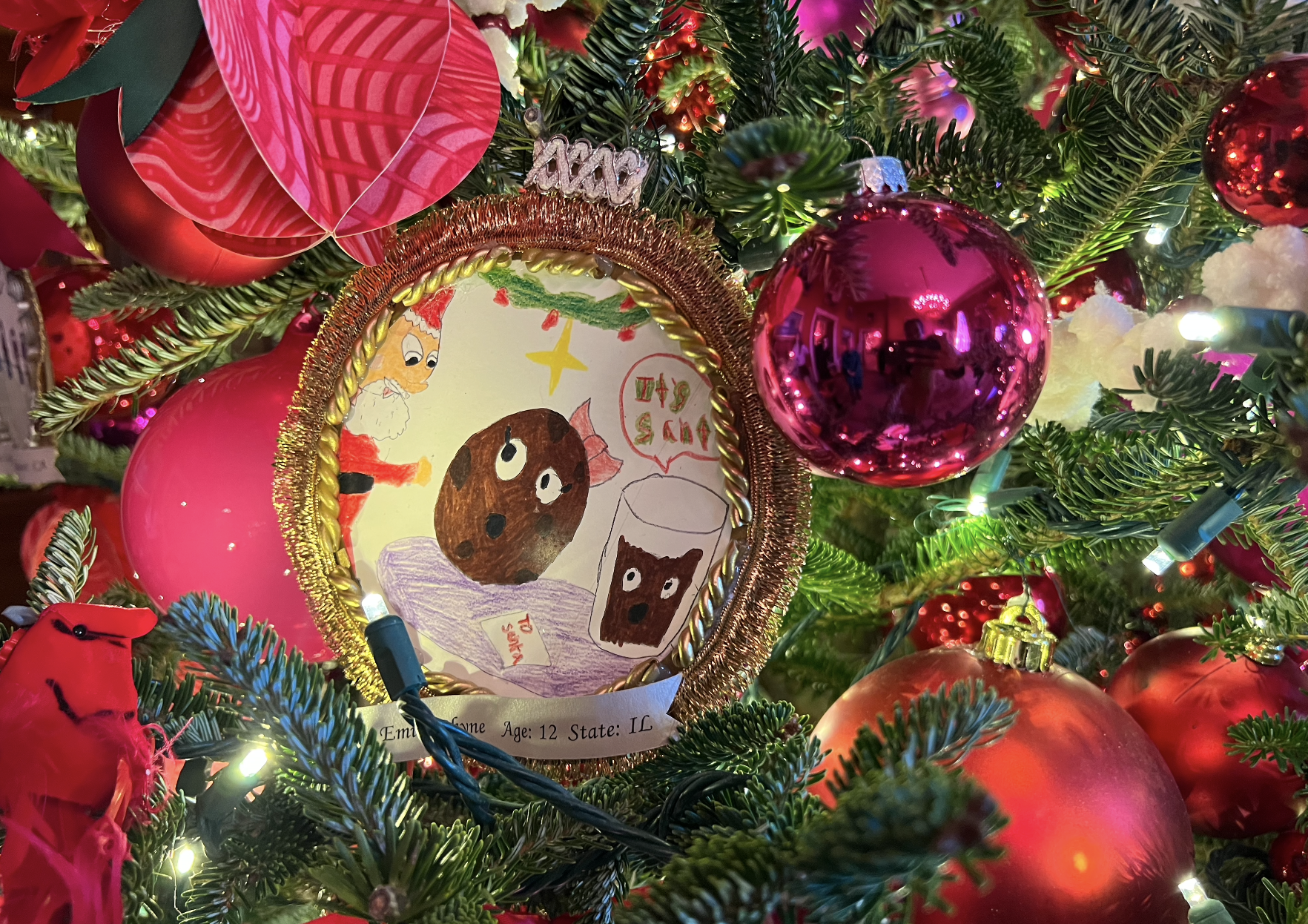 A closeup of a Christmas ornament made by a child.
