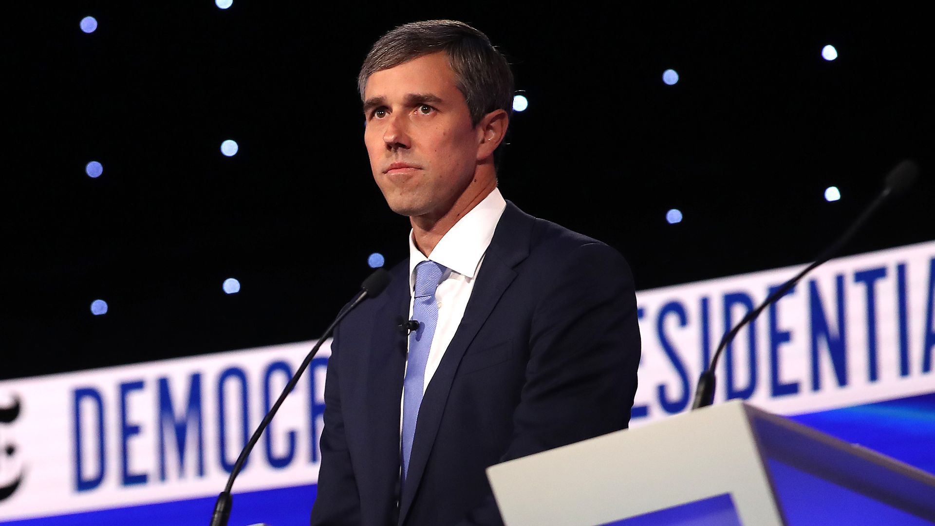 Beto O'Rourke standing on stage.