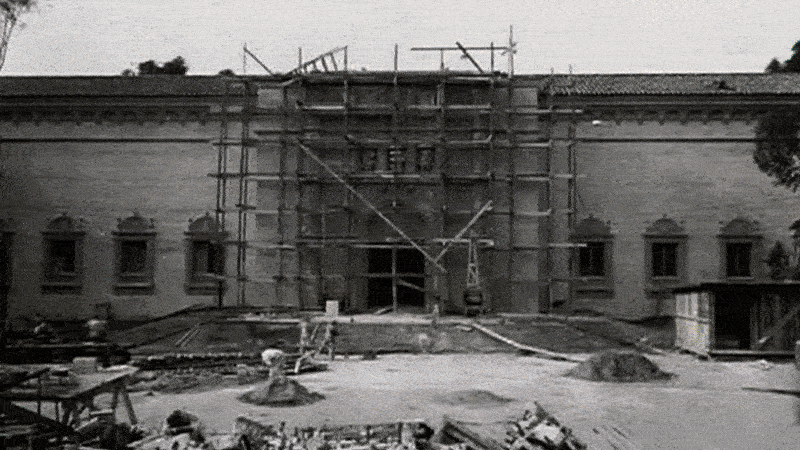 Three images of the San Diego Museum of Art through the years. The first image is a black and white photo of the building under construction with scaffolding, the second shows the white building with intricate design and red roof, and the third is in 2025 with people walking by outside. 