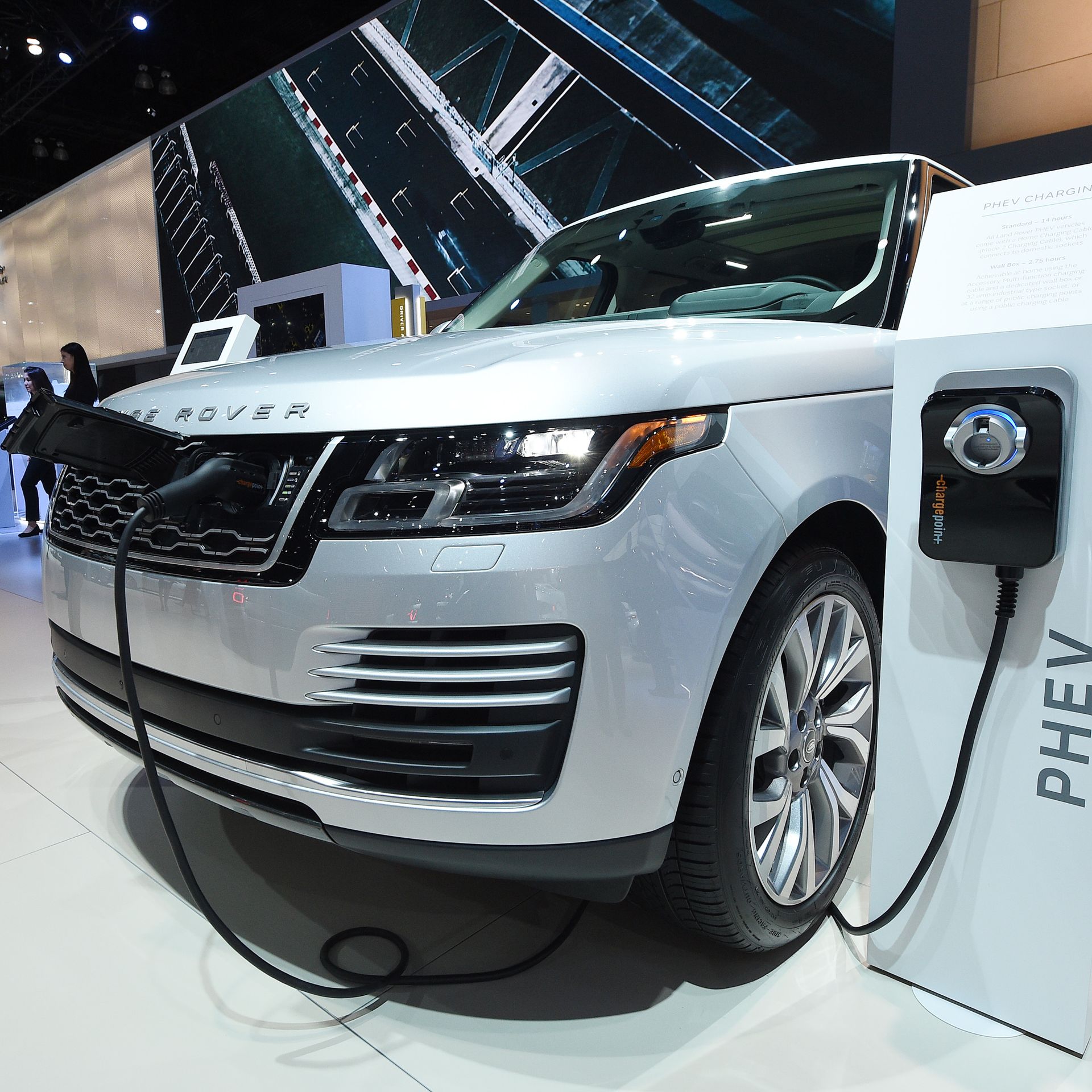 Hybrid Range Rover model and charging station at car show