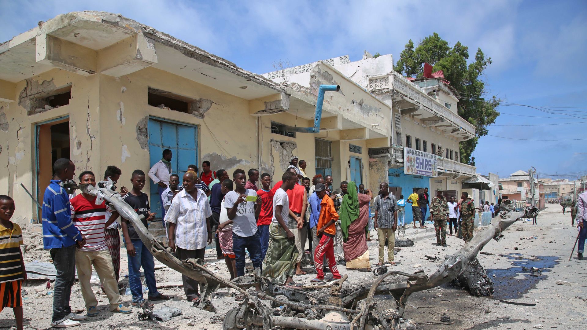 Somalian citizens after a double car bomb kills three people