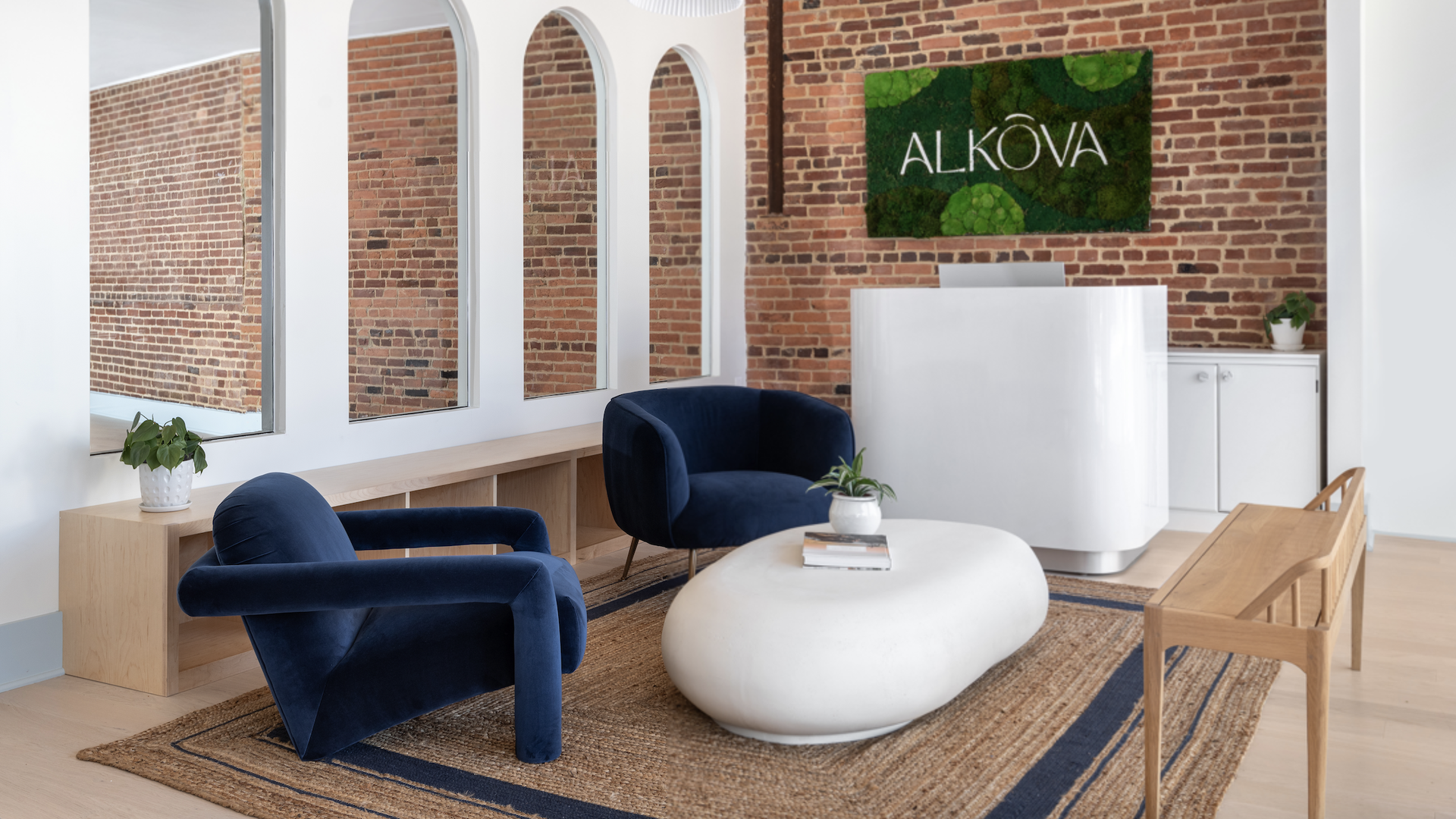 A seating area with a sign reading "Alkova" in the background.