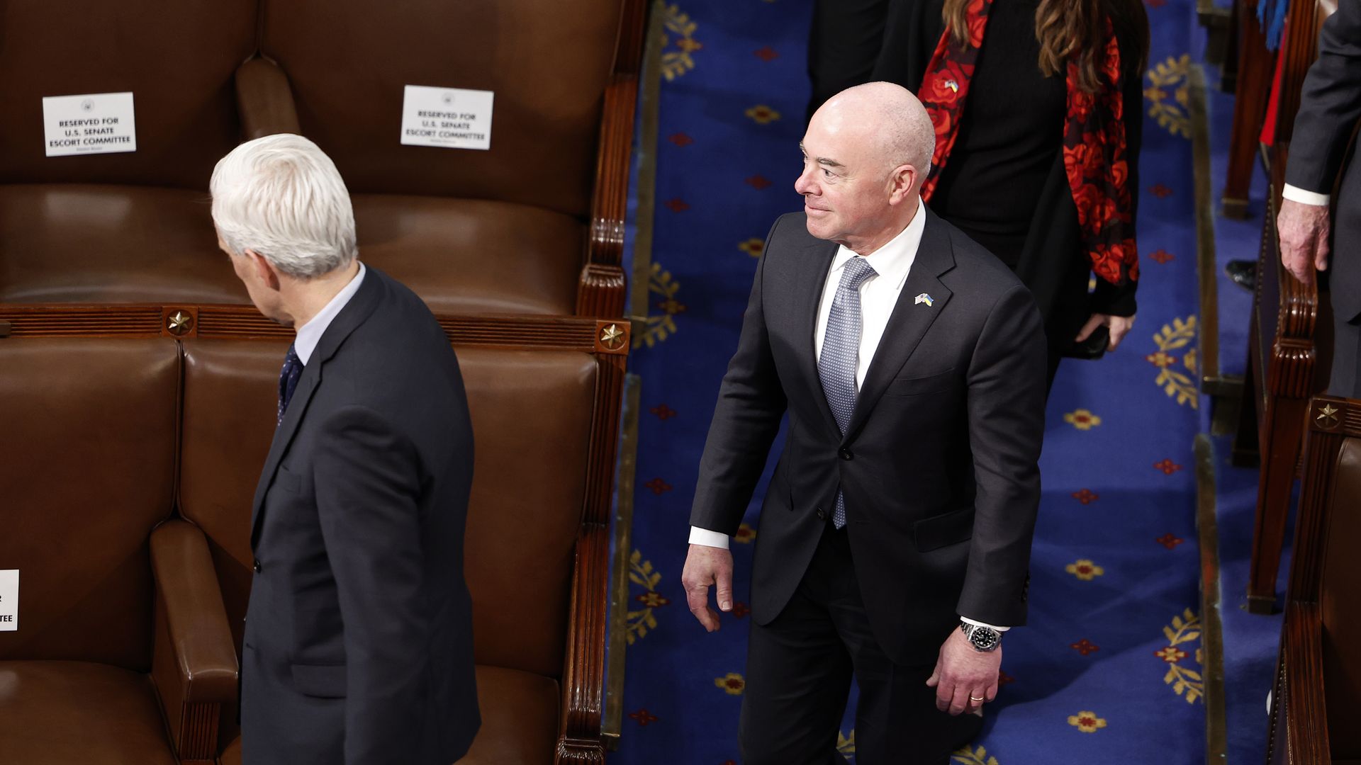 U.S. Secretary of Homeland Security Alejandro Mayorkas (R) arrives for an address during a joint meeting of Congress