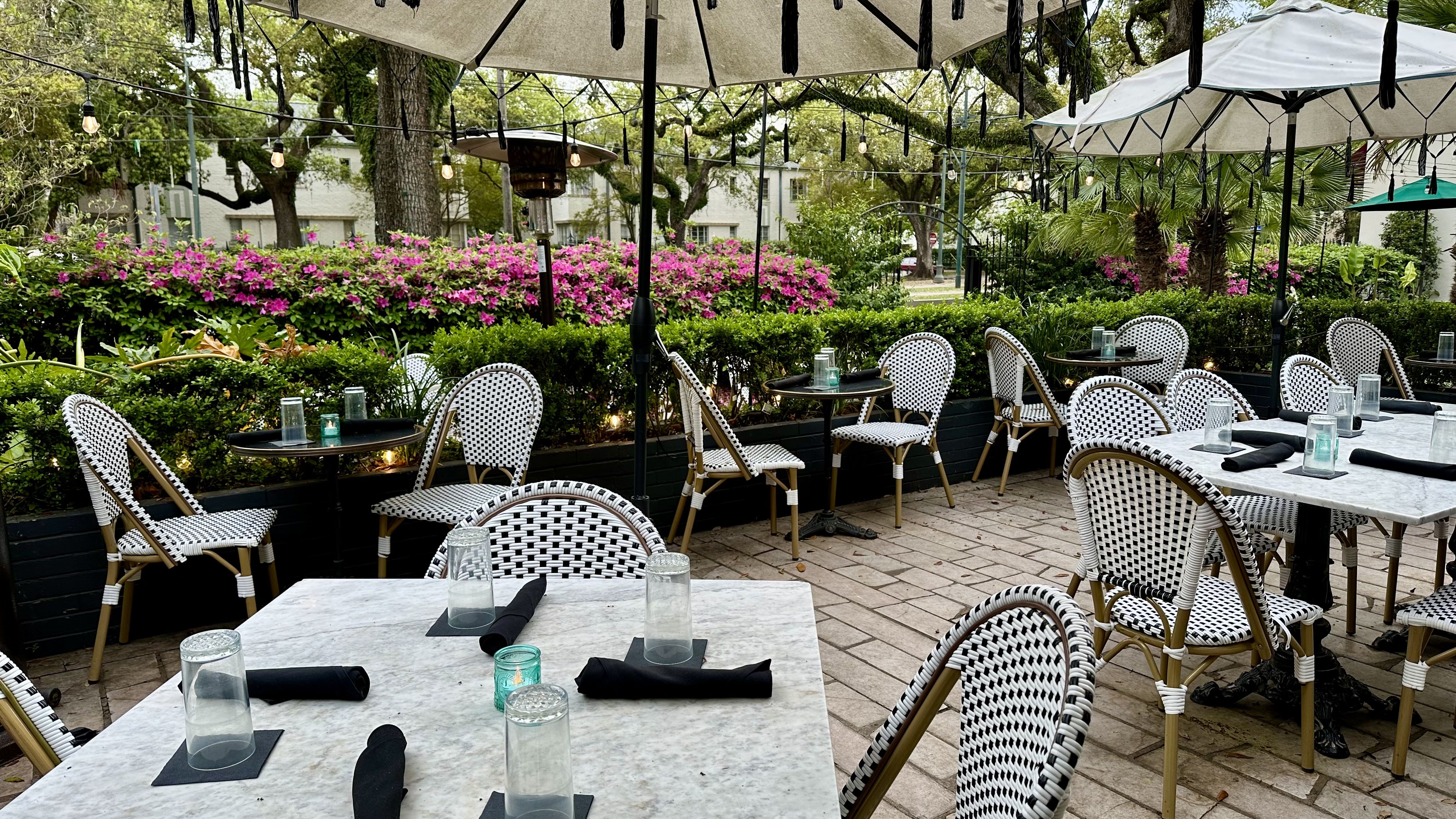 Photo shows the patio tables and chairs at The Chloe