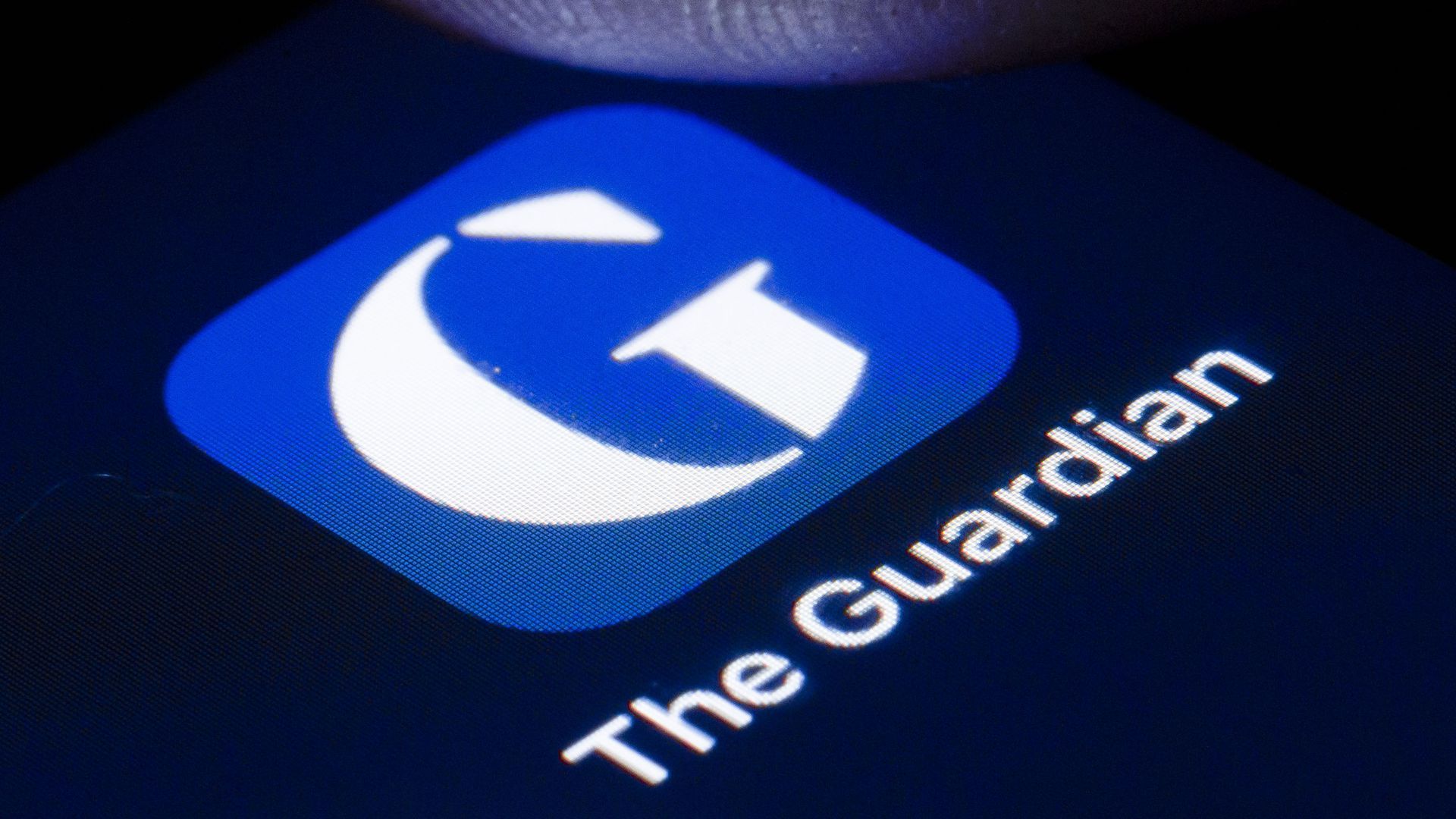 A photo of a Guardian app on a phone. 
